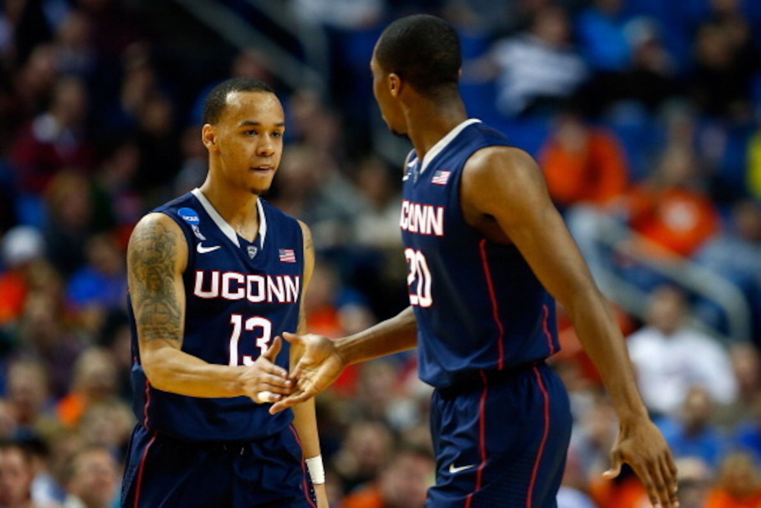 BUFFALO, NY - MARCH 22: Shabazz Napier #13 celebrates with Lasan Kromah #20 of the Connecticut Huskies during the third round of the 2014 NCAA Men's Basketball Tournament against the Villanova Wildcats at the First Niagara Center on March 22, 2014 in Buff