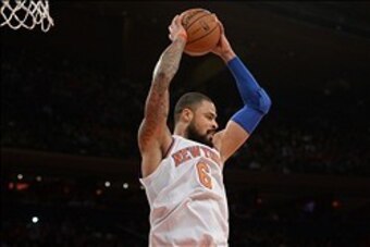Jan 28, 2014; New York, NY, USA; New York Knicks center Tyson Chandler (6) grabs a rebound against the Boston Celtics during the first half at Madison Square Garden. Mandatory Credit: Joe Camporeale-USA TODAY Sports