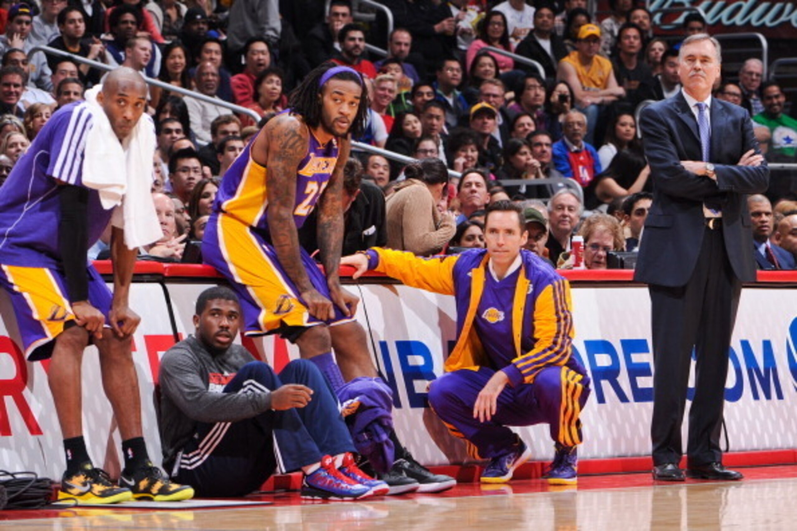 LOS ANGELES, CA - JANUARY 4: Head Coach Mike D'Antoni of the Los Angeles Lakers, along with players Steve Nash #10, Jordan Hill #27 and Kobe Bryant #24, looks from the sideline during a game against the Los Angeles Clippers at Staples Center on January 4, LOS ANGELES, CA - JANUARY 4: Head Coach Mike D'Antoni of the Los Angeles Lakers, along with players Steve Nash #10, Jordan Hill #27 and Kobe Bryant #24, looks from the sideline during a game against the Los Angeles Clippers at Staples Center on January 4,