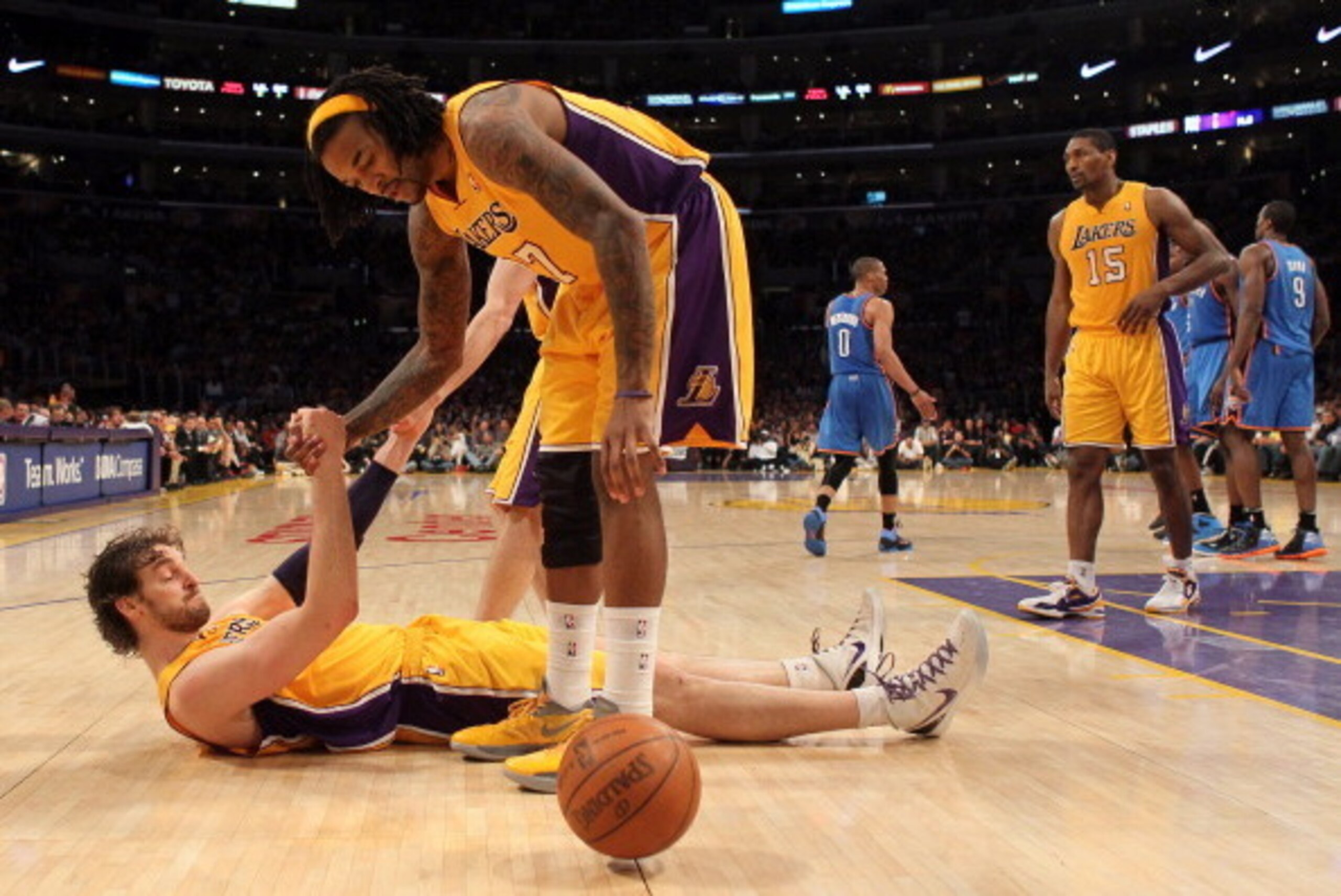 LOS ANGELES, CA - MAY 19: Jordan Hill #27 helps up Pau Gasol #16 of the Los Angeles Lakers in the fourth quarter while taking on the Oklahoma City Thunder in Game Four of the Western Conference Semifinals in the 2012 NBA Playoffs on May 19 at Staples Cen LOS ANGELES, CA - MAY 19: Jordan Hill #27 helps up Pau Gasol #16 of the Los Angeles Lakers in the fourth quarter while taking on the Oklahoma City Thunder in Game Four of the Western Conference Semifinals in the 2012 NBA Playoffs on May 19 at Staples Cen