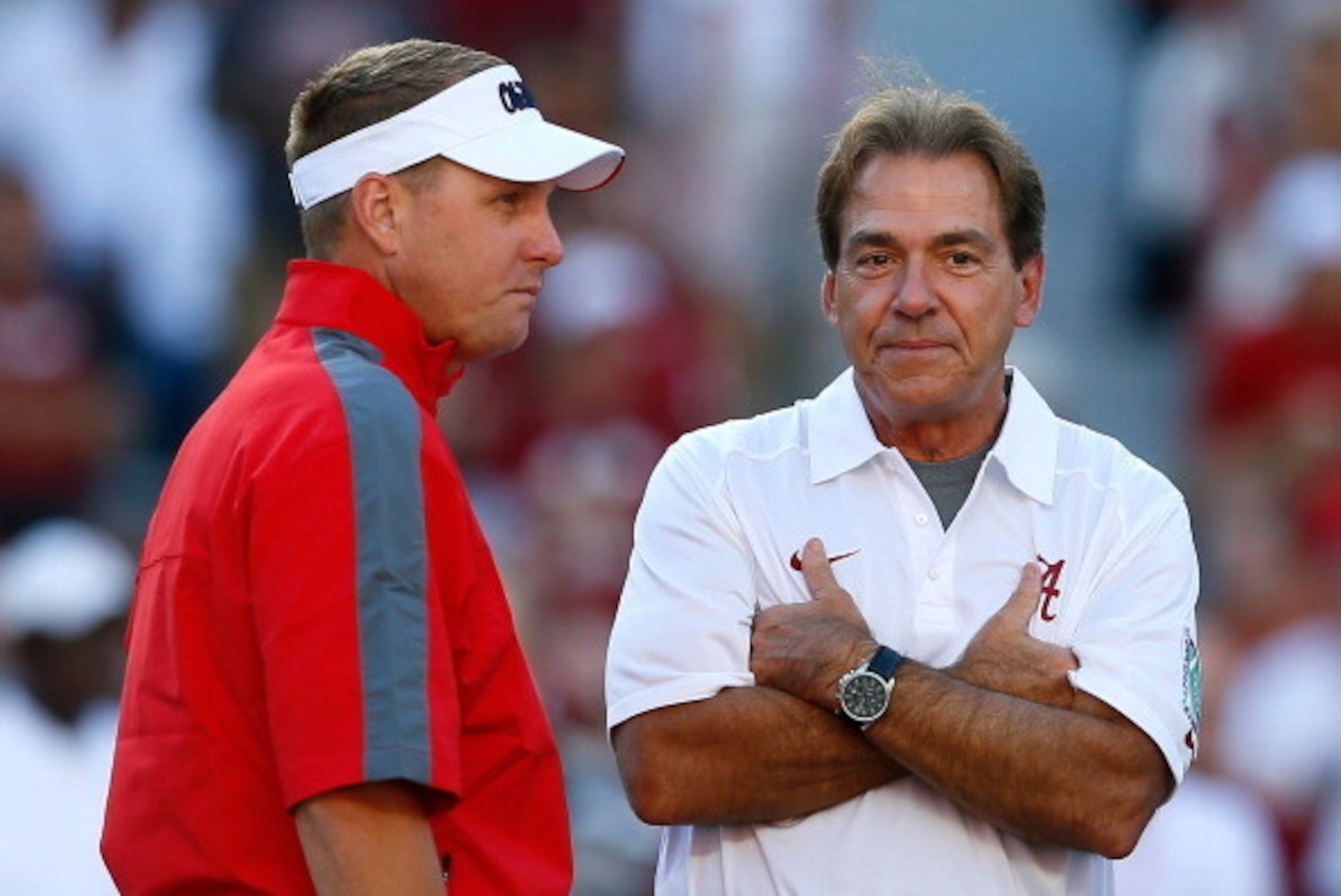 TUSCALOOSA, AL - SEPTEMBER 28:  Head coach Hugh Freeze of the Mississippi Rebels converses with head coach Nick Saban of the Alabama Crimson Tide prior to their game at Bryant-Denny Stadium on September 28, 2013 in Tuscaloosa, Alabama.  (Photo by Kevin C.