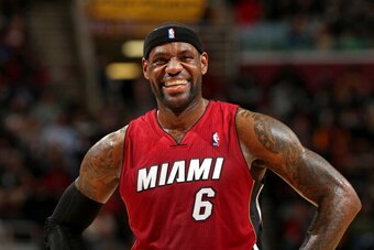 CLEVELAND, OH - MARCH 18:  LeBron James #6 of the Miami Heat smiles during the game against the Cleveland Cavaliers at The Quicken Loans Arena on March 18, 2014 in Cleveland, Ohio. NOTE TO USER: User expressly acknowledges and agrees that, by downloading 