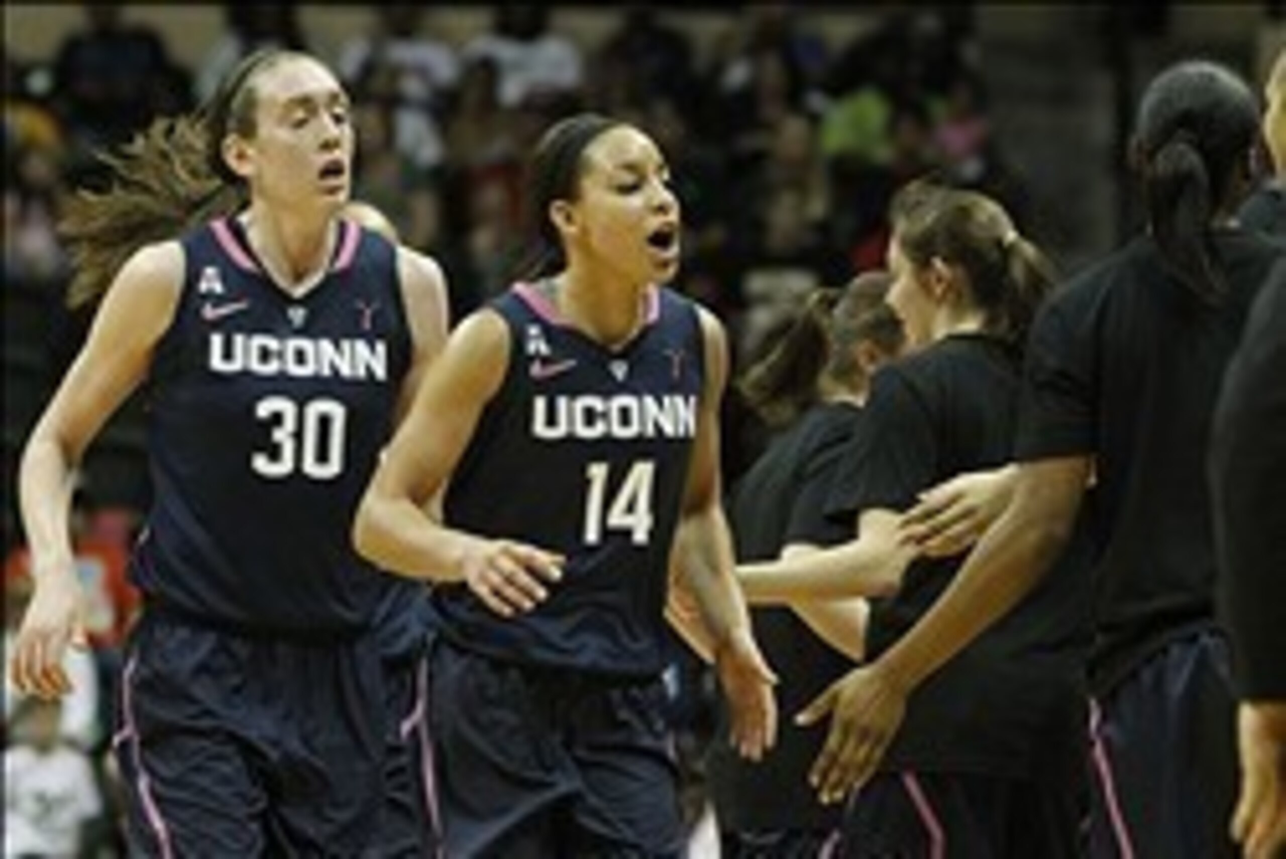 Feb 16, 2014; Tampa, FL, USA; Connecticut Huskies guard Bria Hartley (14) celebrates with forward Breanna Stewart (30) against the South Florida Bulls during the second half at USF Sun Dome. The Huskies won 63-38. Mandatory Credit: Kim Klement-USA TODAY S