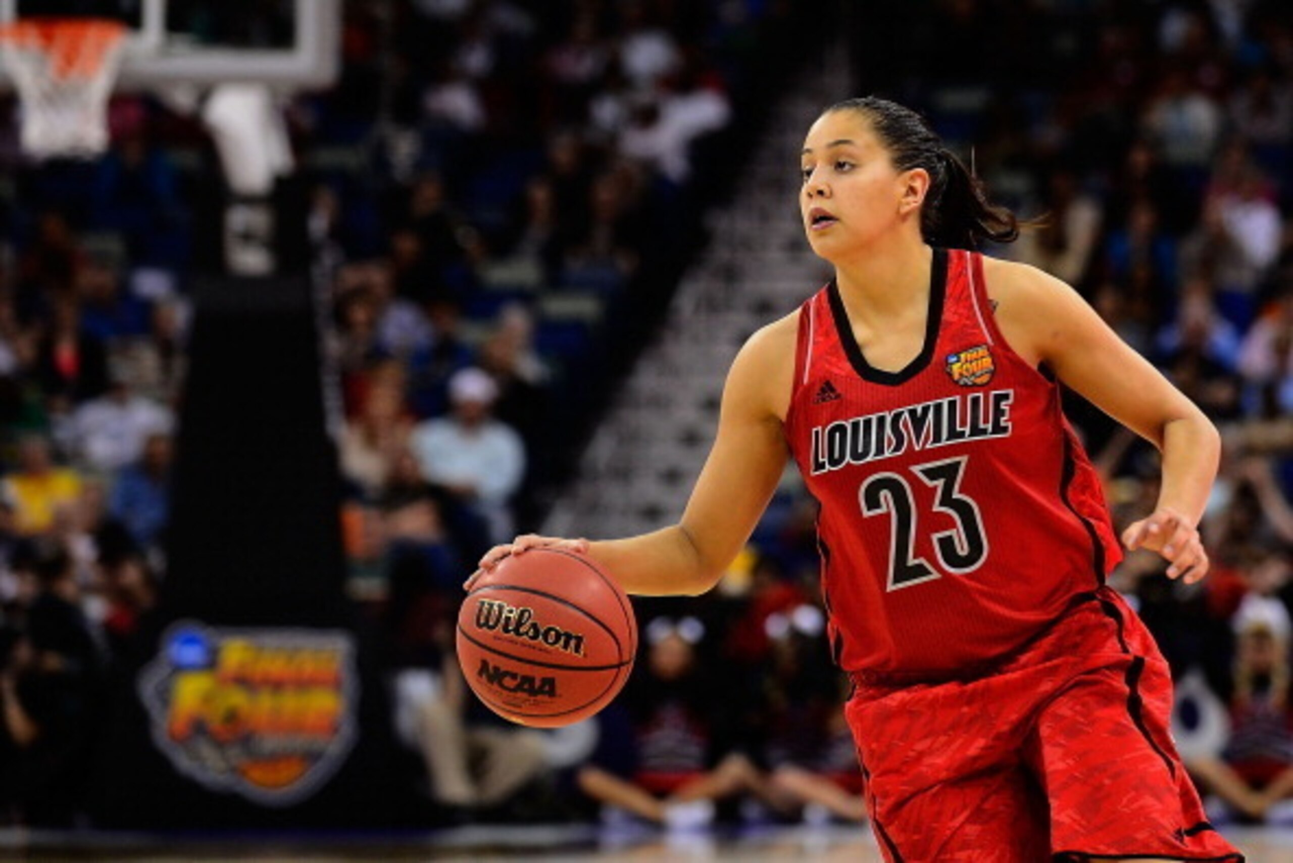 NEW ORLEANS, LA - APRIL 09:  Shoni Schimmel #23 of the Louisville Cardinals looks for an open team mate against the Connecticut Huskies during the National Final game of the 2013 NCAA Division I Women's Basketball Championship at New Orleans Arena on Apri