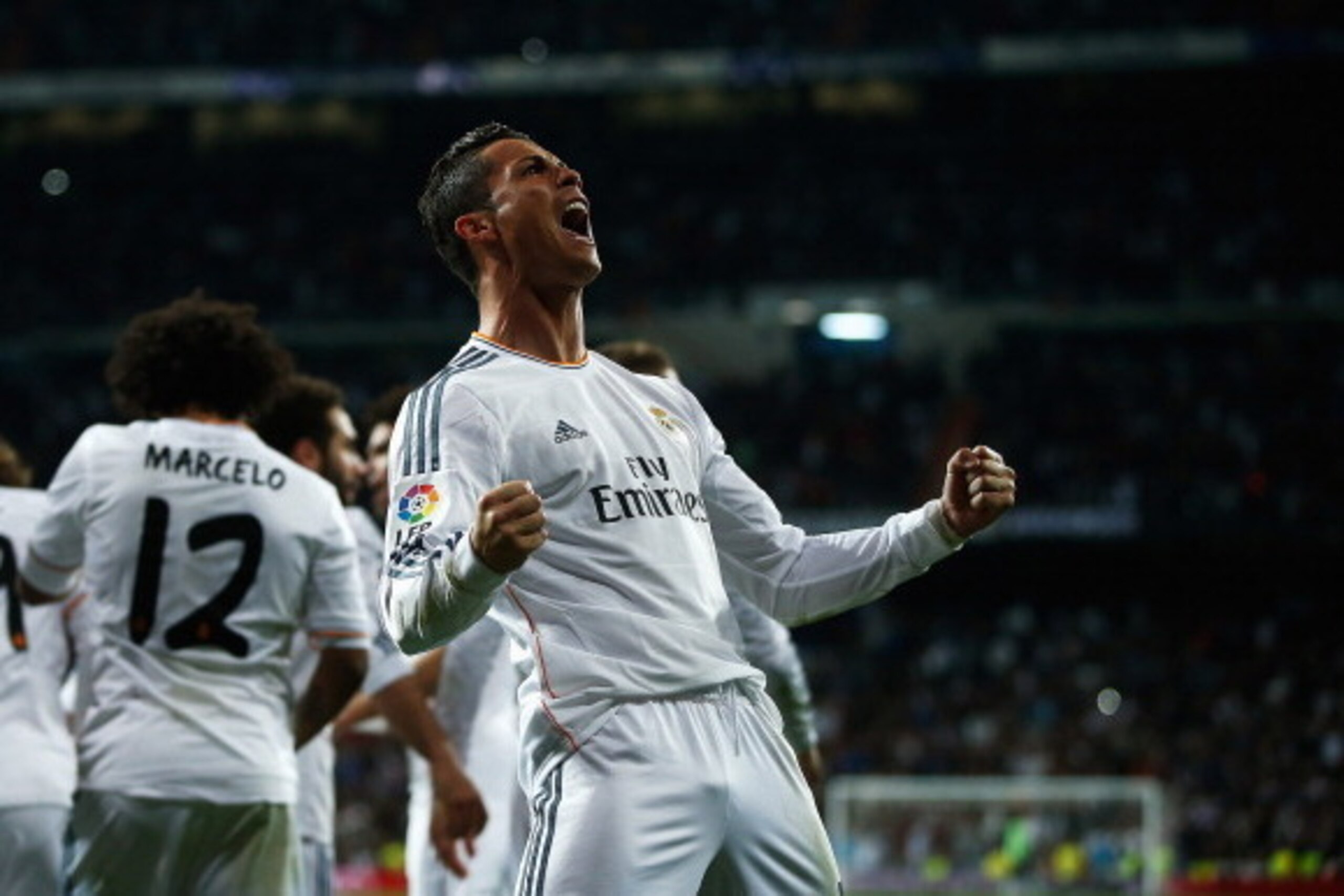 MADRID, SPAIN - MARCH 23:  Cristiano Ronaldo of Real Madrid celebrates his team's third goal during the La Liga match between Real Madrid CF and FC Barcelona at the Bernabeu on March 23, 2014 in Madrid, Spain.  (Photo by Gonzalo Arroyo Moreno/Getty Images