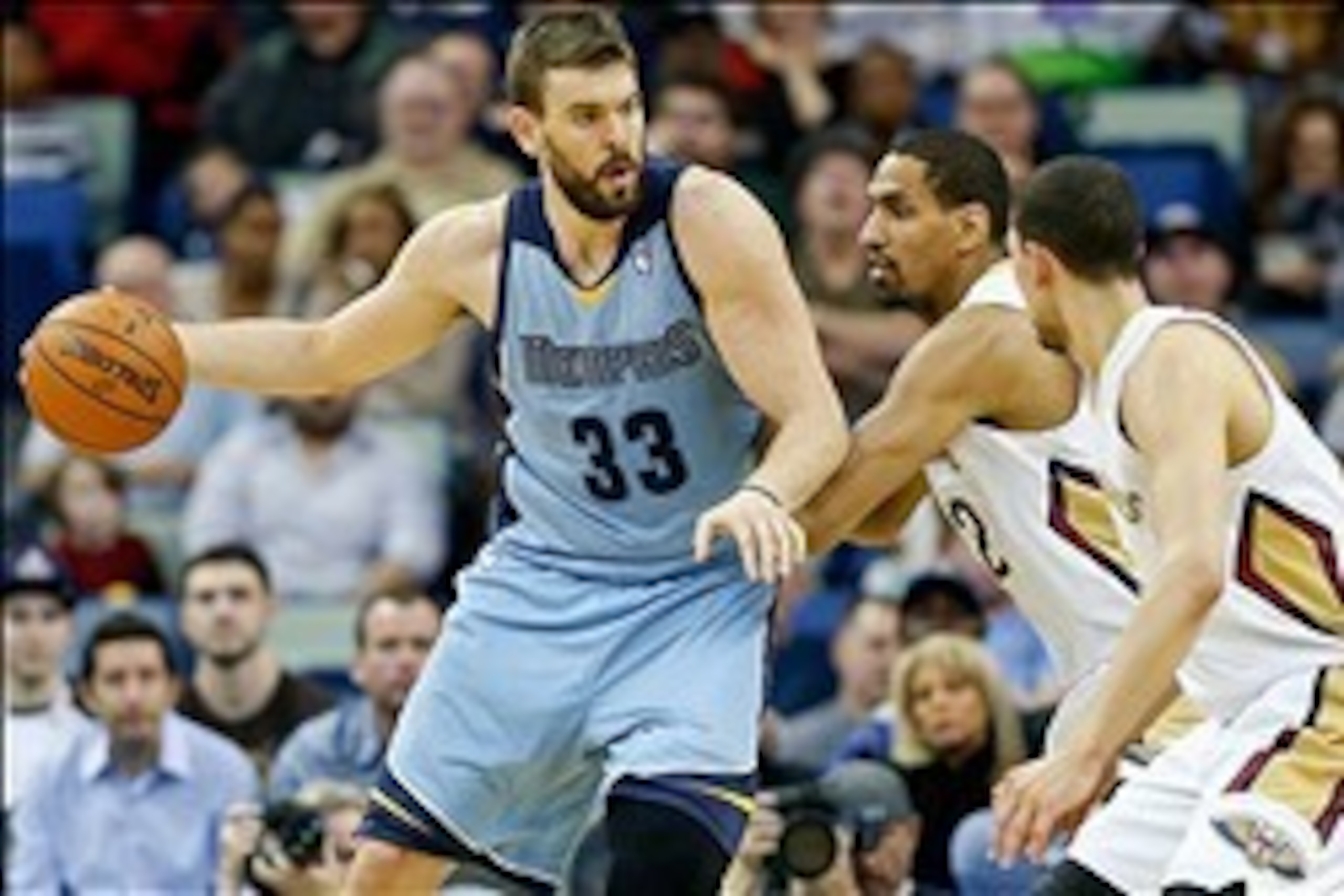 Mar 12, 2014; New Orleans, LA, USA; Memphis Grizzlies center Marc Gasol (33) is guarded by New Orleans Pelicans center Alexis Ajinca (42) during the second quarter of a game at the Smoothie King Center. Mandatory Credit: Derick E. Hingle-USA TODAY Sports