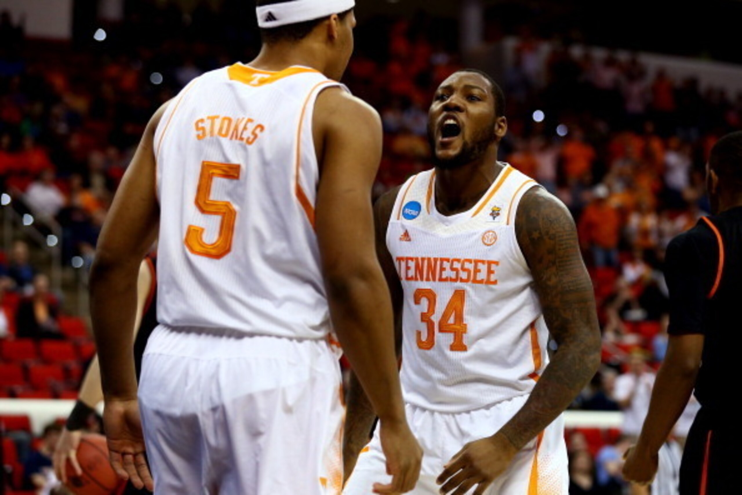 RALEIGH, NC - MARCH 23:  Jeronne Maymon #34 and Jarnell Stokes #5 of the Tennessee Volunteers celebrate after a play early in the first half against the Mercer Bears during the third round of the 2014 NCAA Men's Basketball Tournament at PNC Arena on March