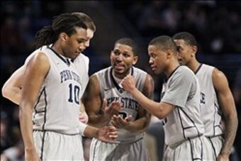 Feb 27, 2014; University Park, PA, USA; Penn State Nittany Lions guard D.J. Newbill (center) talks to his teammates during the second half against the Ohio State Buckeyes at Bryce Jordan Center. Penn State defeated Ohio State 65-63. Mandatory Credit: Matt