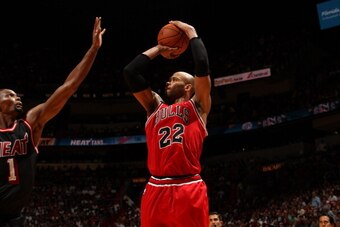 MIAMI, FL - February 23: Taj Gibson #22 of the Chicago Bulls shoots the ball against the Miami Heat at the American Airlines Arena in Miami, Florida on Feb. 3, 2014. NOTE TO USER: User expressly acknowledges and agrees that, by downloading and/or using th