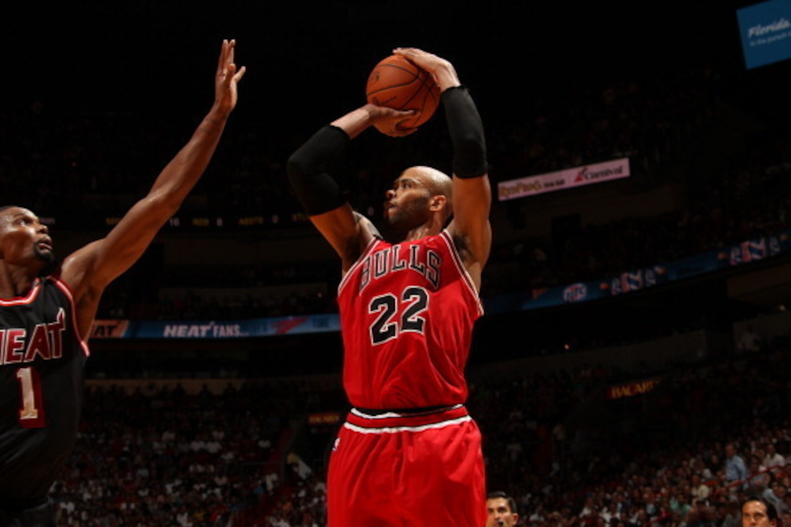 MIAMI, FL - February 23: Taj Gibson #22 of the Chicago Bulls shoots the ball against the Miami Heat at the American Airlines Arena in Miami, Florida on Feb. 3, 2014. NOTE TO USER: User expressly acknowledges and agrees that, by downloading and/or using th MIAMI, FL - February 23: Taj Gibson #22 of the Chicago Bulls shoots the ball against the Miami Heat at the American Airlines Arena in Miami, Florida on Feb. 3, 2014. NOTE TO USER: User expressly acknowledges and agrees that, by downloading and/or using th