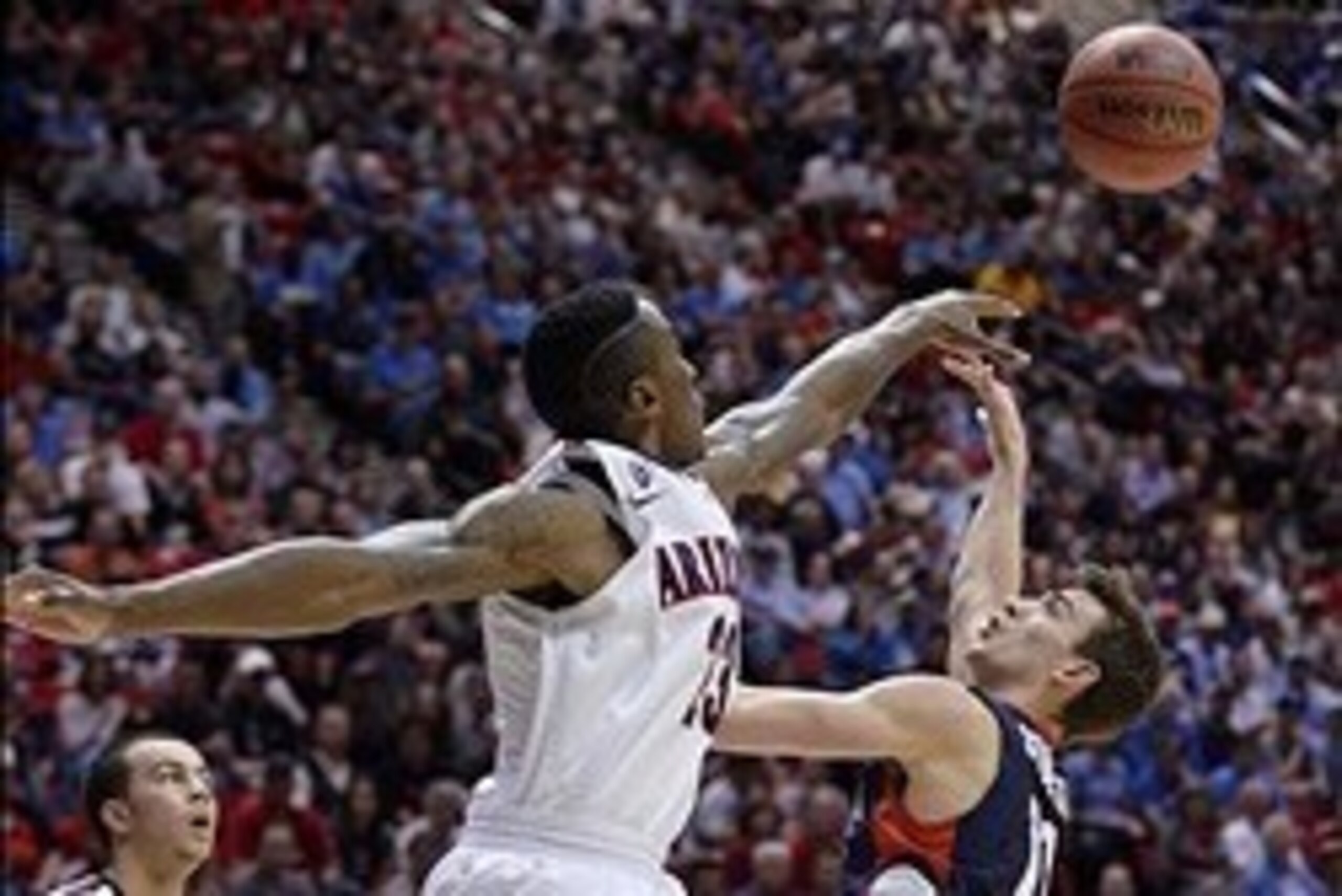 Mar 23, 2014; San Diego, CA, USA; Gonzaga Bulldogs guard David Stockton (11) attempts a shot against Arizona Wildcats forward Rondae Hollis-Jefferson (23) in the first half of a men's college basketball game during the third round of the 2014 NCAA Tournam