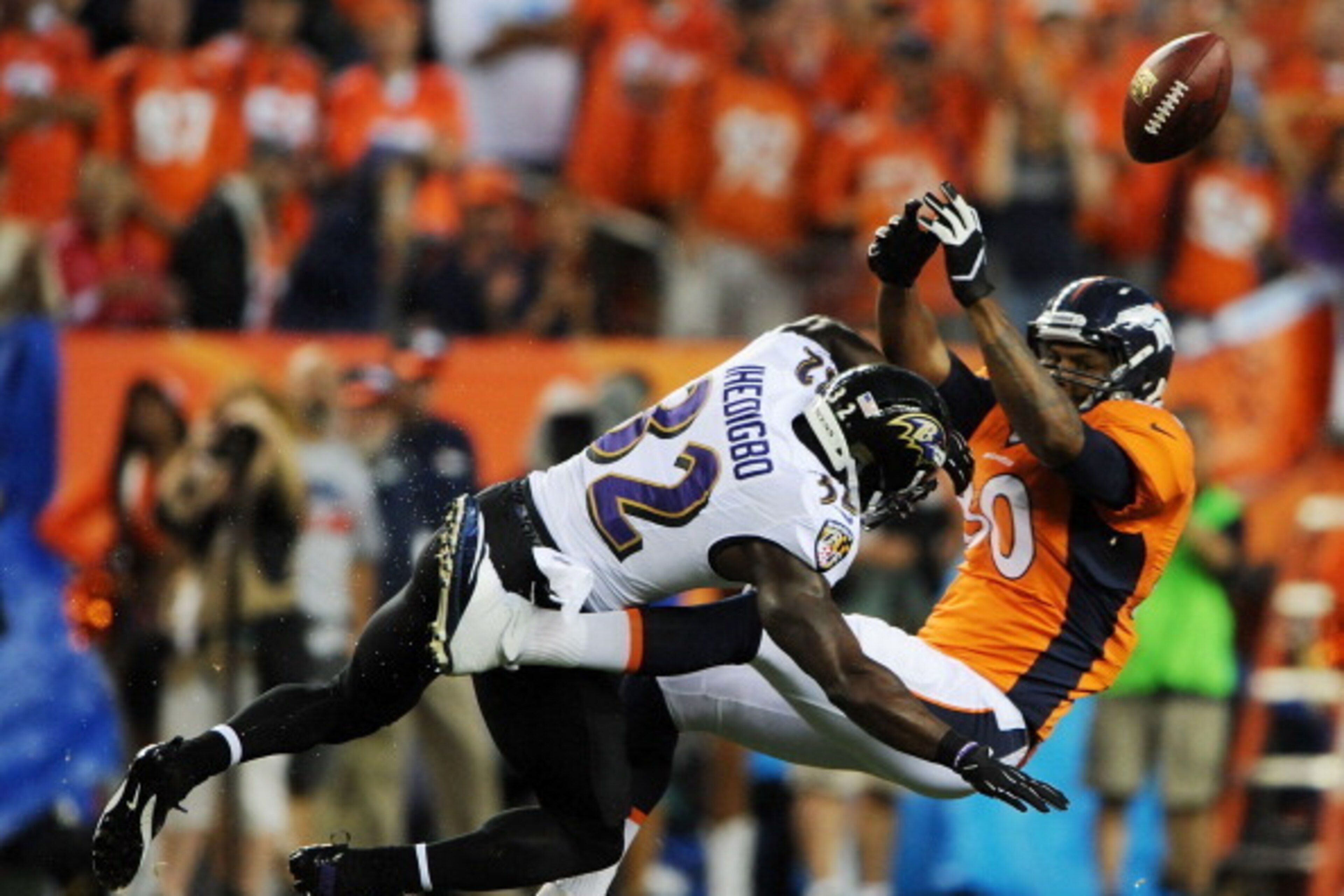 DENVER, CO - SEPTEMBER 5: James Ihedigbo #32 of the Baltimore Ravens hits Julius Thomas #80 of the Denver Broncos as he attempts to catch a pass in the first quarter during the game at Sports Authority Field at Mile High on September 5, 2013 in Denver Col DENVER, CO - SEPTEMBER 5: James Ihedigbo #32 of the Baltimore Ravens hits Julius Thomas #80 of the Denver Broncos as he attempts to catch a pass in the first quarter during the game at Sports Authority Field at Mile High on September 5, 2013 in Denver Col