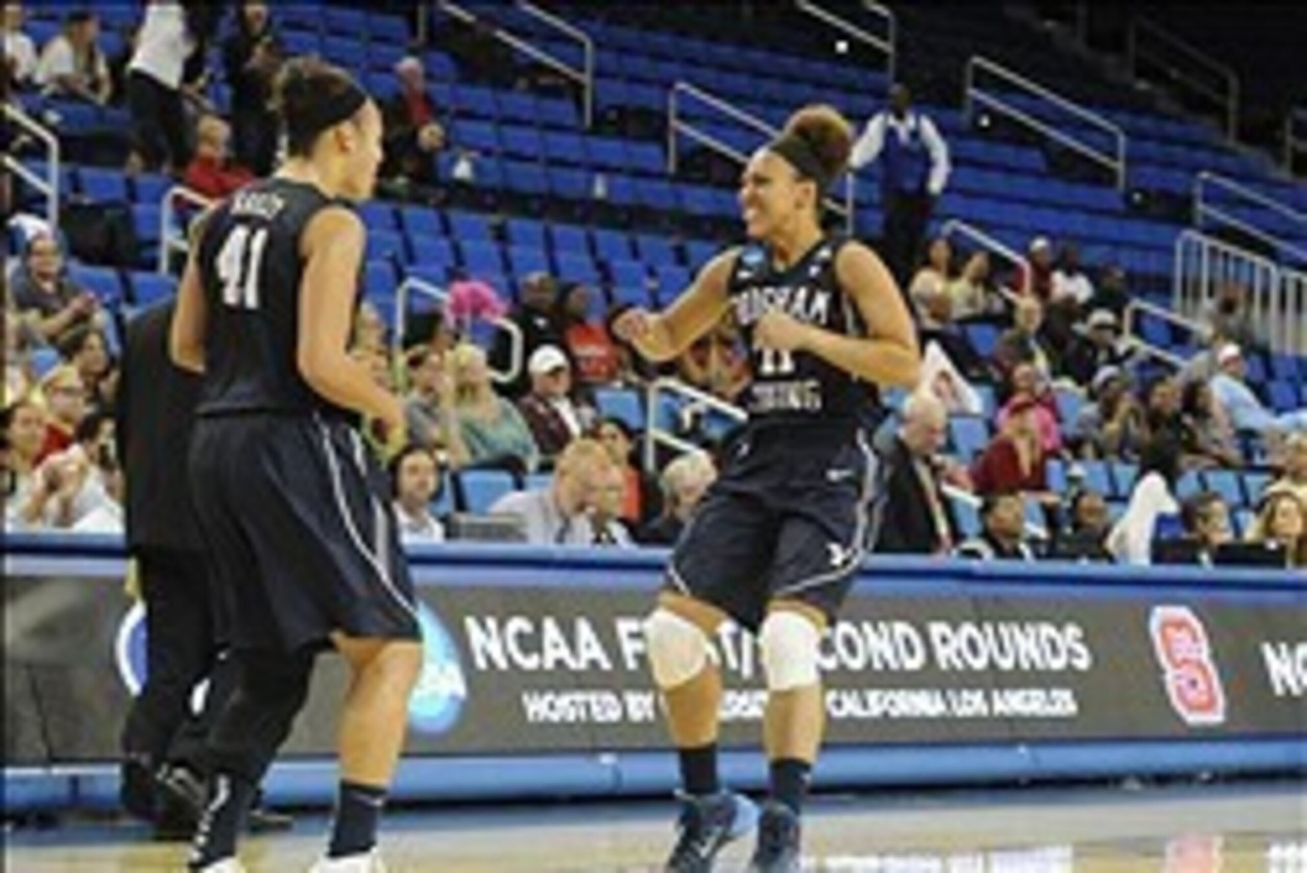Mar 22, 2014; Los Angeles, CA, USA; Brigham Young Cougars guard Xojian Harry (11) and forward Morgan Bailey (41) react after defeating the North Carolina State Wolfpack at the end of the second of a women's college basketball game in the first round of th