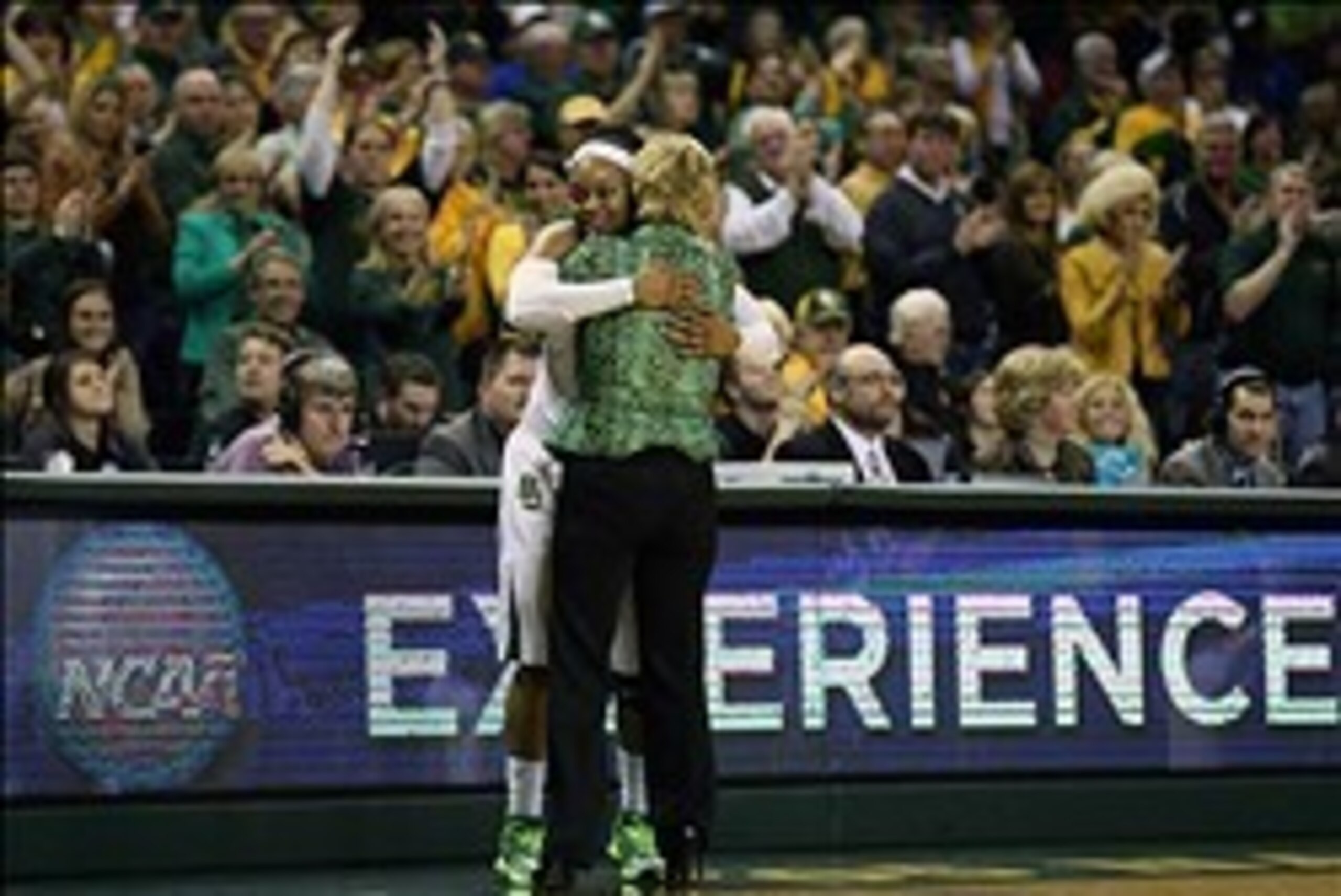Mar 24, 2014; Waco, TX, USA; Baylor Bears guard Odyssey Sims (0) celebrates with head coach Kim Mulkey after getting substituted out against the California Golden Bears in the second half of a women's college basketball game in the second round of the NCA