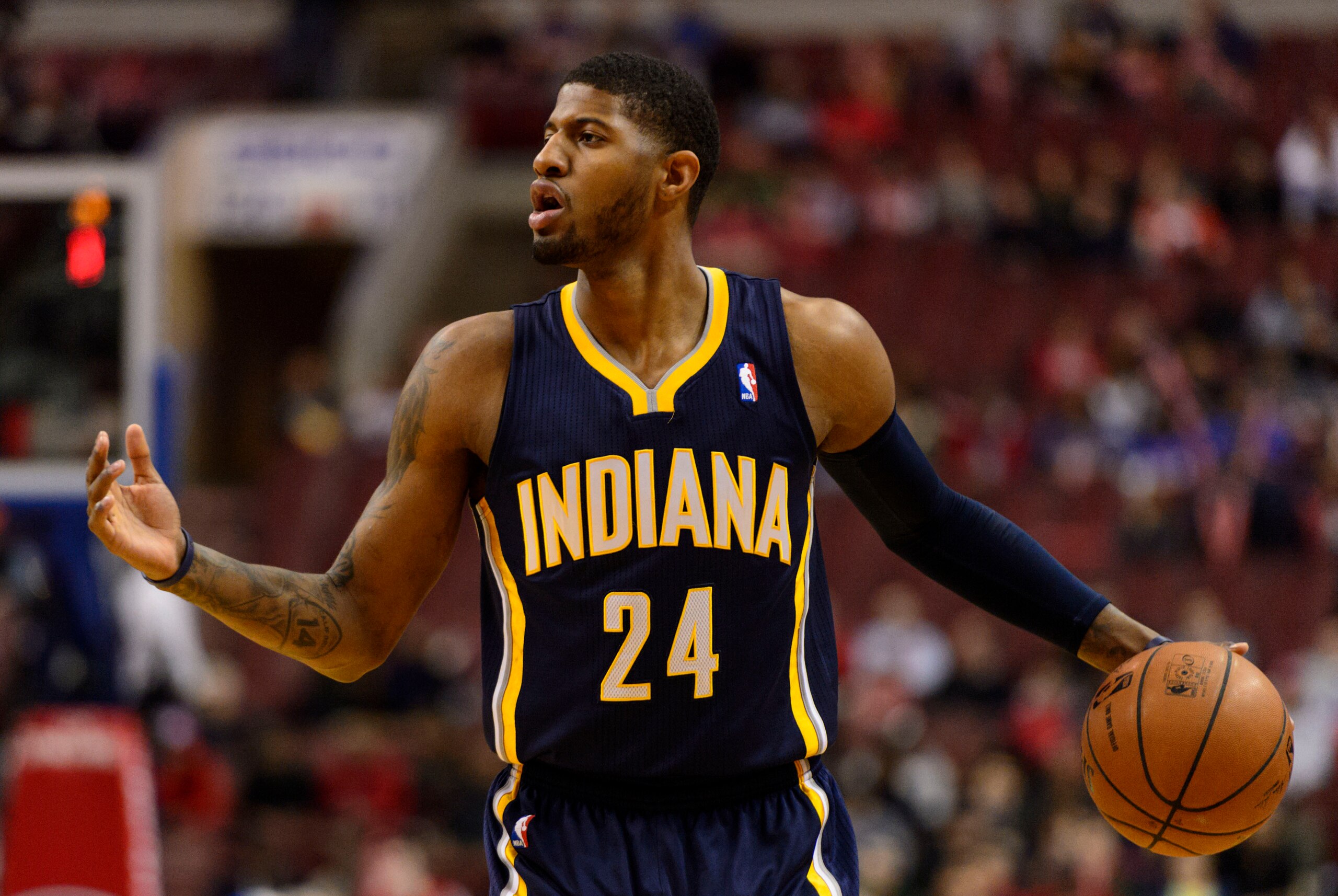 Mar 14, 2014; Philadelphia, PA, USA; Indiana Pacers forward Paul George (24) adjusts the offense during the first quarter against the Philadelphia 76ers at the Wells Fargo Center. The Pacers defeated the Sixers 101-94. Mandatory Credit: Howard Smith-USA T