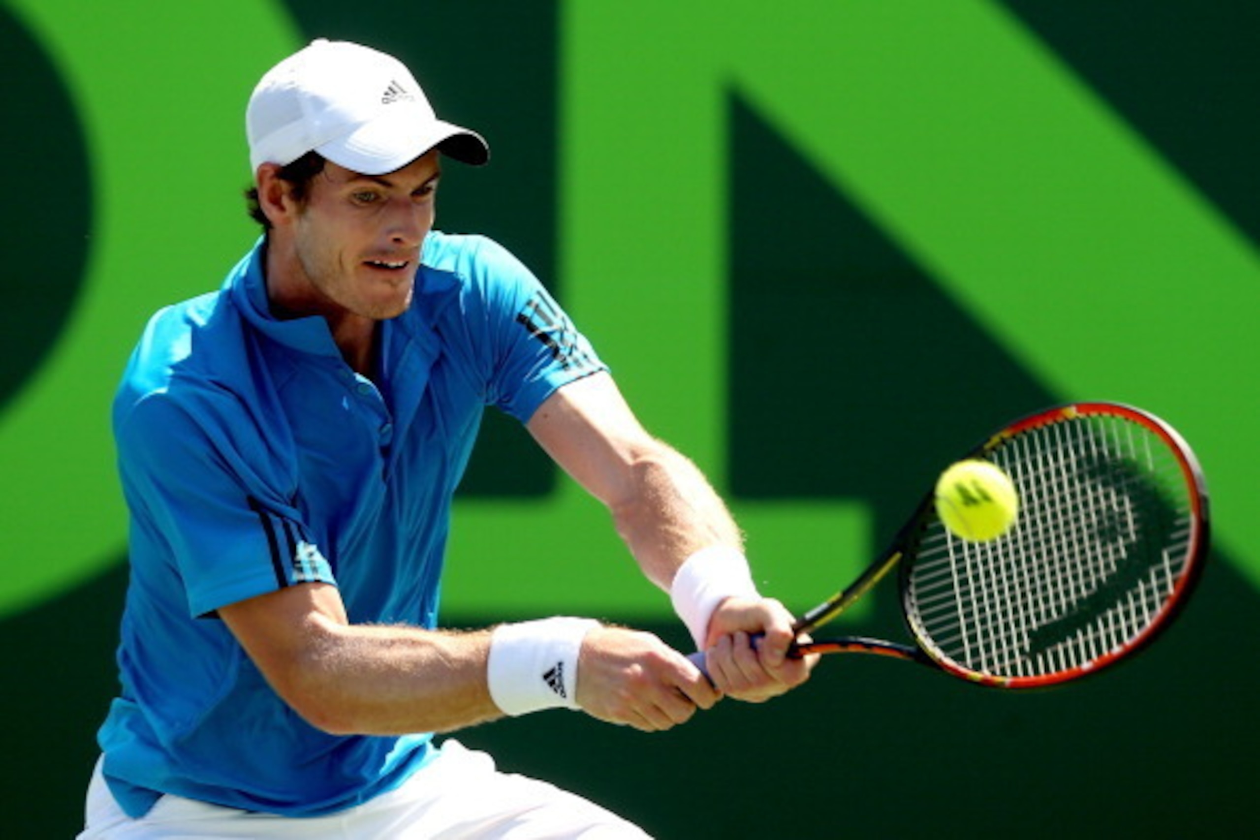 KEY BISCAYNE, FL - MARCH 23:  Andy Murray of Great Britain returns a shot to Feliciano Lopez of Spain during the Sony Open at the Crandon Park Tennis Center on March 23, 2014 in Key Biscayne, Florida.  (Photo by Matthew Stockman/Getty Images)
