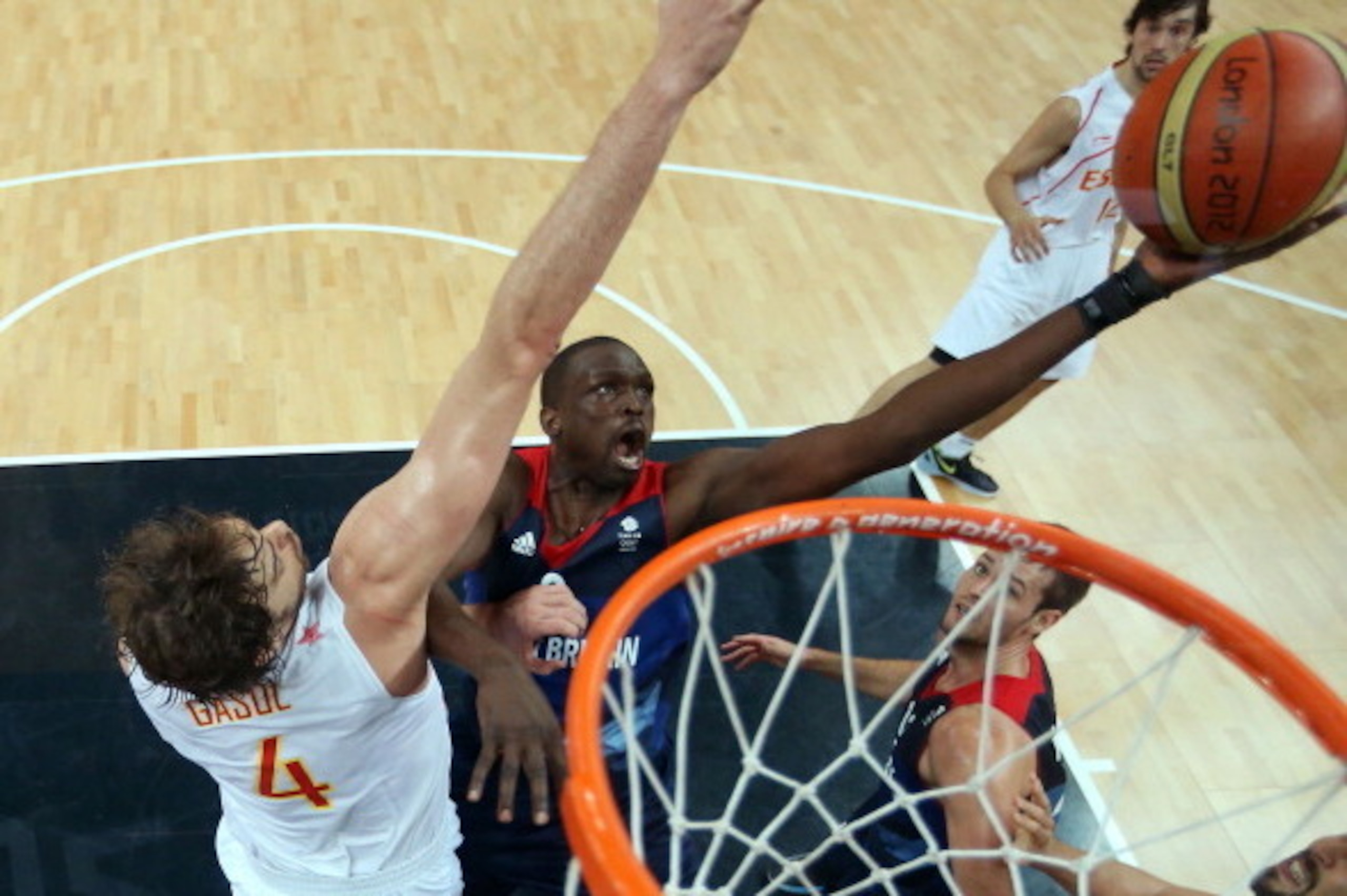 LONDON, ENGLAND - AUGUST 02:  (EDITORS NOTE: A polarizing filter was used for this image.)  Luol Deng #9 of Great Britain shoots against Pau Gasol #4 of Spain in the second half during the Men's Basketball Preliminary Round match on Day 6 of the London 20