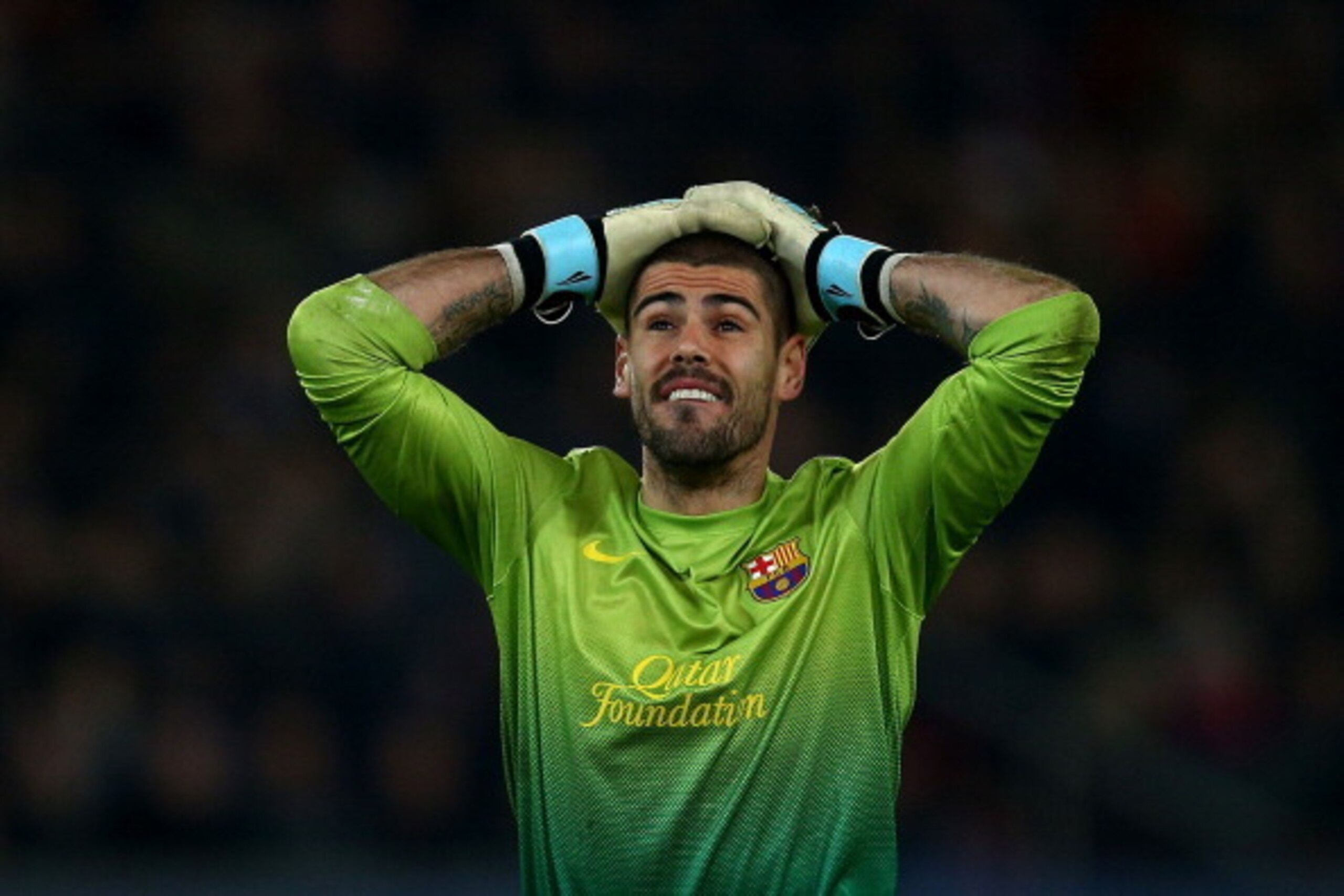 PARIS, FRANCE - APRIL 02:  Victor Valdes of Barcelona reacts during the UEFA Champions League Quarter Final match between Paris Saint-Germain and Barcelona FCB at Parc des Princes on April 2, 2013 in Paris, France.  (Photo by Clive Rose/Getty Images)
