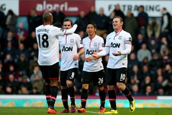 LONDON, ENGLAND - MARCH 22: (R-L) Wayne Rooney of Manchester United is congratulated by teammates Shinji Kagawa, Juan Mata and Ashley Young after scoring his team's second goal during the Barclays Premier League match between West Ham United and Manchest LONDON, ENGLAND - MARCH 22: (R-L) Wayne Rooney of Manchester United is congratulated by teammates Shinji Kagawa, Juan Mata and Ashley Young after scoring his team's second goal during the Barclays Premier League match between West Ham United and Manchest