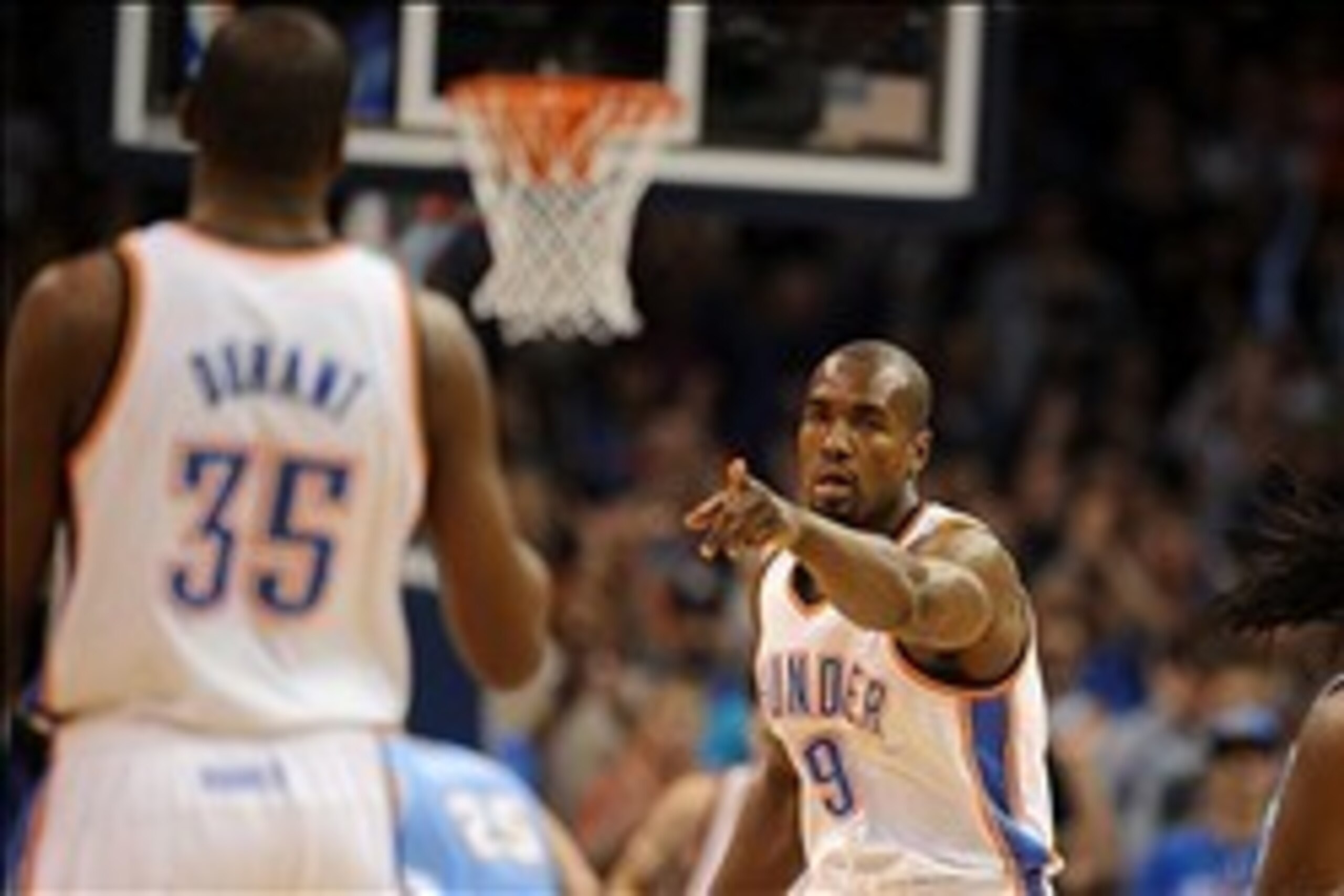 Mar 24, 2014; Oklahoma City, OK, USA;  Oklahoma City Thunder forward Serge Ibaka (9) points to Oklahoma City Thunder forward Kevin Durant (35) after receiving an assist in action against the Denver Nuggets at Chesapeake Energy Arena. Mandatory Credit: Mar