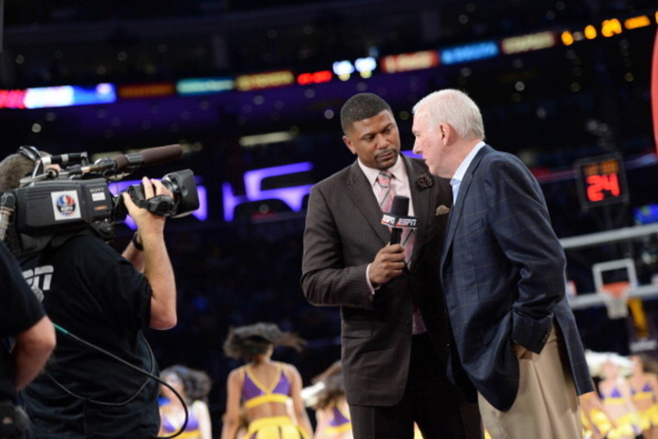 LOS ANGELES, CA - MARCH 19: ESPN's Jalen Rose interviews Gregg Popovich of the San Antonio Spurs during a timeout in a game against the Los Angeles Lakers at Staples Center on March 19, 2014 in Los Angeles, California. NOTE TO USER: User expressly acknowl