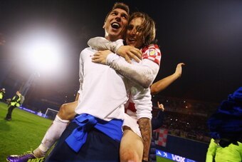 ZAGREB, CROATIA - NOVEMBER 19:  Mario Mandzukic of Croatia celebrates with team mate Luka Modric (top) after the FIFA 2014 World Cup Qualifier play-off second leg match between Croatia and Iceland at Maksimir Stadium on November 19, 2013 in Zagreb, Croati