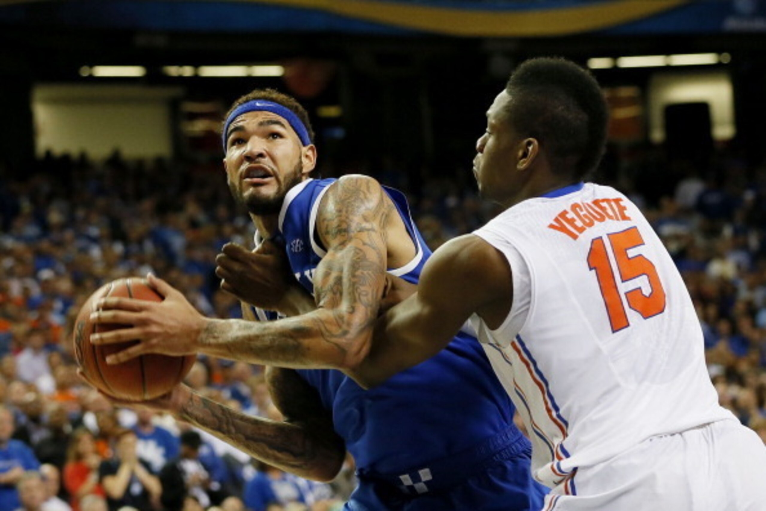 ATLANTA, GA - MARCH 16:  Will Yeguete #15 of the Florida Gators defends against Willie Cauley-Stein #15 of the Kentucky Wildcats in the second half during the Championship game of the 2014 Men's SEC Basketball Tournament at Georgia Dome on March 16, 2014 