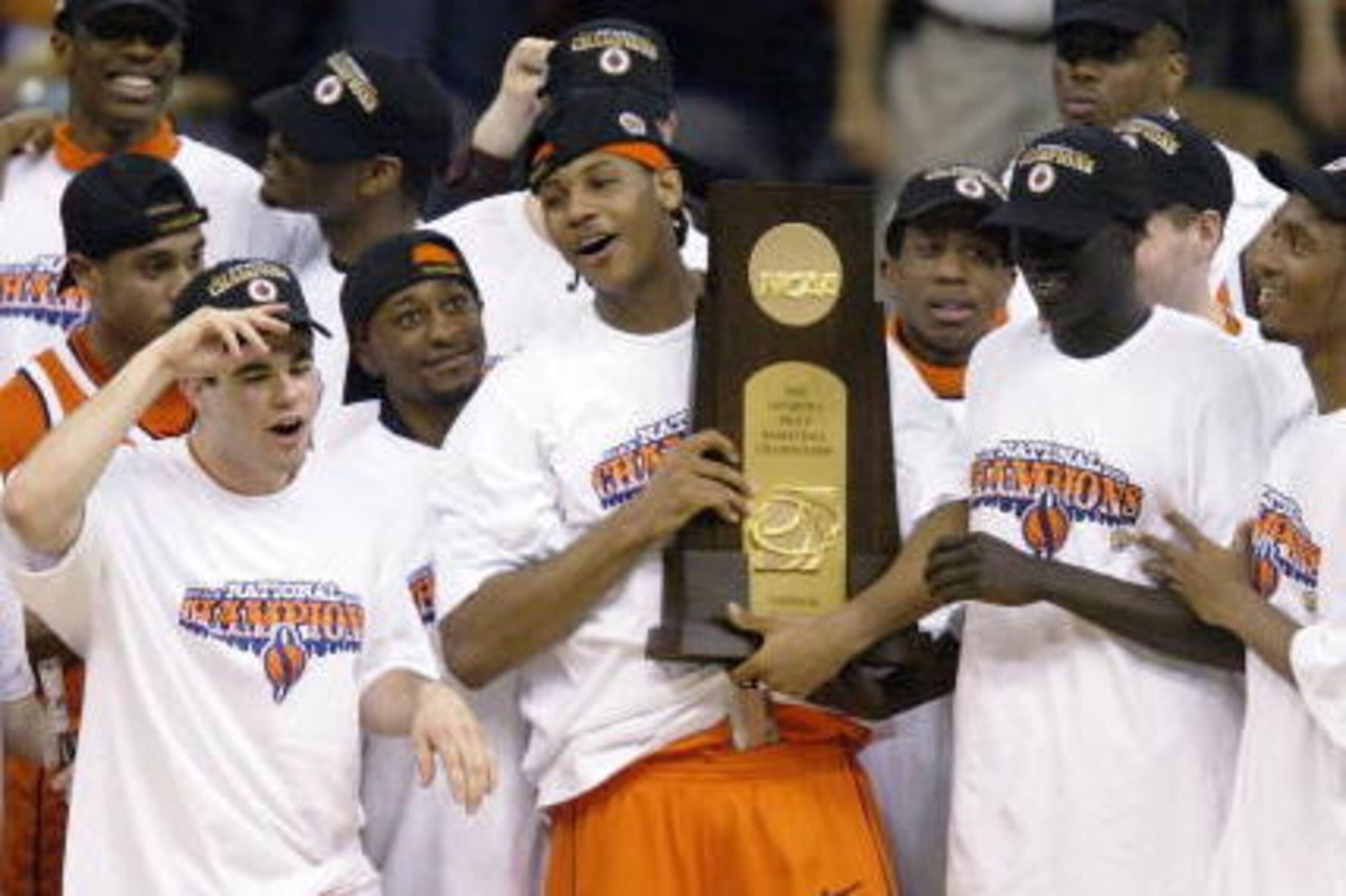 NEW ORLEANS - APRIL 7: Carmelo Anthony #15 and the rest of the Syracuse team celebrate with the championship trophy after defeating Kansas 81-78 during the championship game of the NCAA Men's Final Four Tournament on April 7, 2003 at the Louisiana Superd NEW ORLEANS - APRIL 7: Carmelo Anthony #15 and the rest of the Syracuse team celebrate with the championship trophy after defeating Kansas 81-78 during the championship game of the NCAA Men's Final Four Tournament on April 7, 2003 at the Louisiana Superd