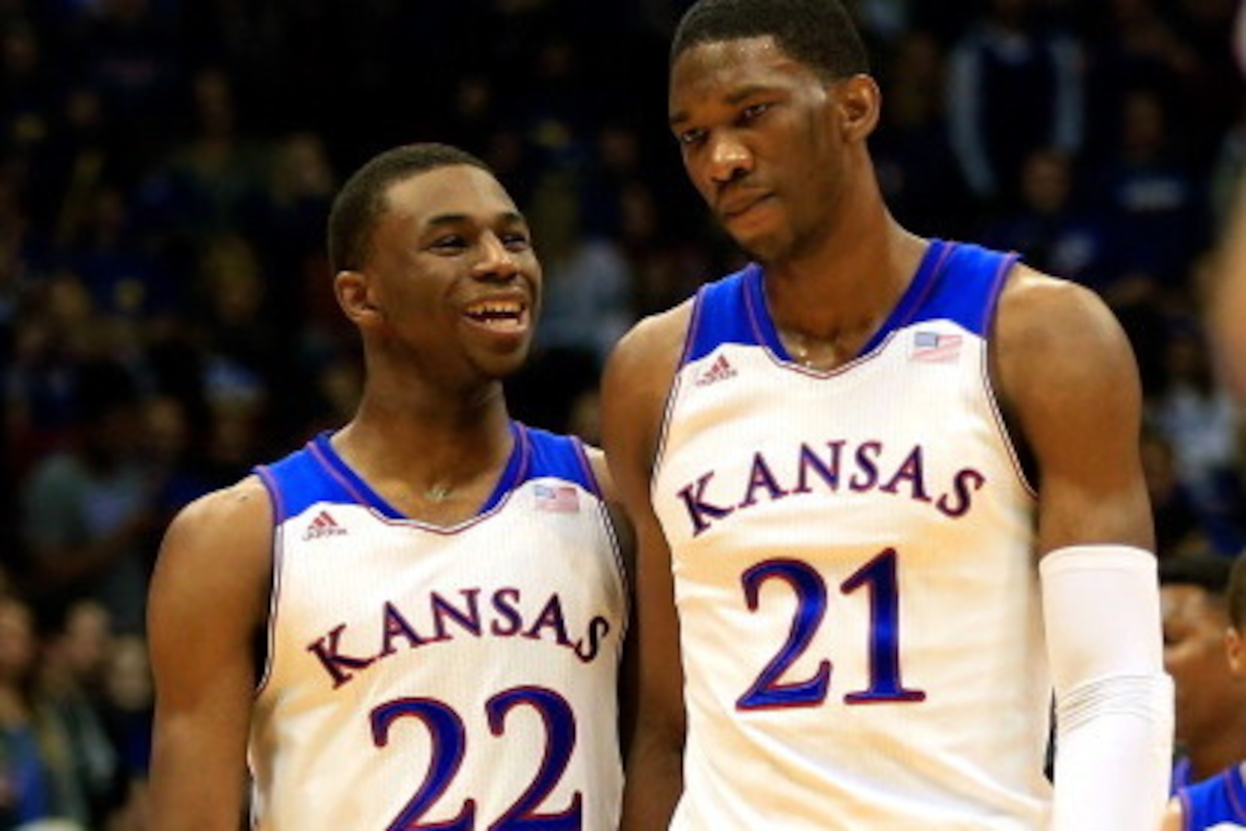 LAWRENCE, KS - NOVEMBER 22: Andrew Wiggins #22 of the Kansas Jayhawks talks with Joel Embiid #21 as they walk onto the floor after a timeout during the game against the Towson Tigers at Allen Fieldhouse on November 22, 2013 in Lawrence, Kansas. (Photo by LAWRENCE, KS - NOVEMBER 22: Andrew Wiggins #22 of the Kansas Jayhawks talks with Joel Embiid #21 as they walk onto the floor after a timeout during the game against the Towson Tigers at Allen Fieldhouse on November 22, 2013 in Lawrence, Kansas. (Photo by