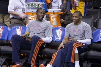 OKLAHOMA CITY, OK - March 13:  Kevin Durant #35 and Russell Westbrook of the Oklahoma City Thunder sit on the bench against the Los Angeles Lakers at the Chesapeake Arena on March 13, 2014 in Oklahoma City, Oklahoma. NOTE TO USER:  User expressly acknowle