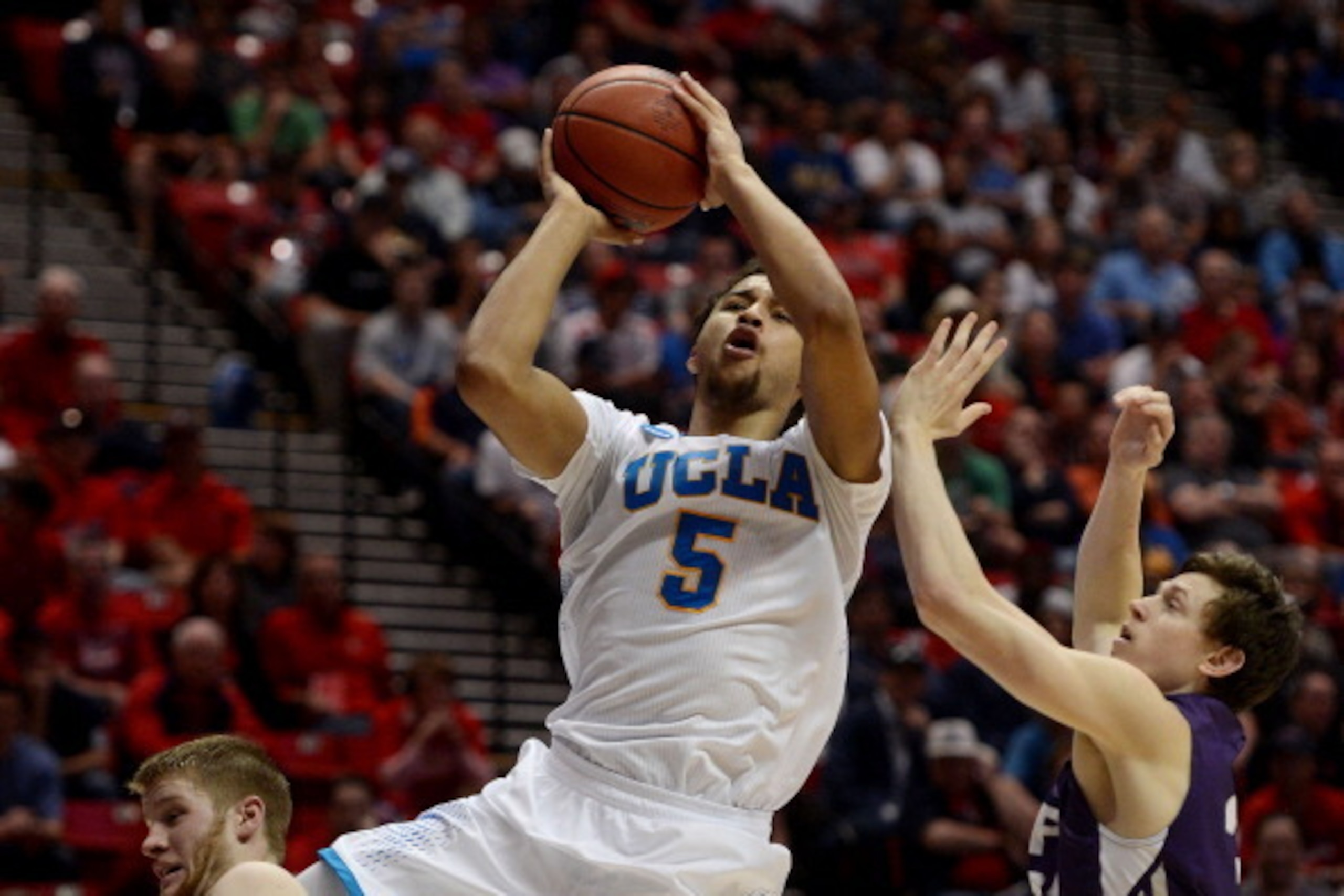 SAN DIEGO, CA - MARCH 23:  Kyle Anderson #5 of the UCLA Bruins goes up against the Stephen F. Austin Lumberjacks during the third round of the 2014 NCAA Men's Basketball Tournament at Viejas Arena on March 23, 2014 in San Diego, California.  (Photo by Don