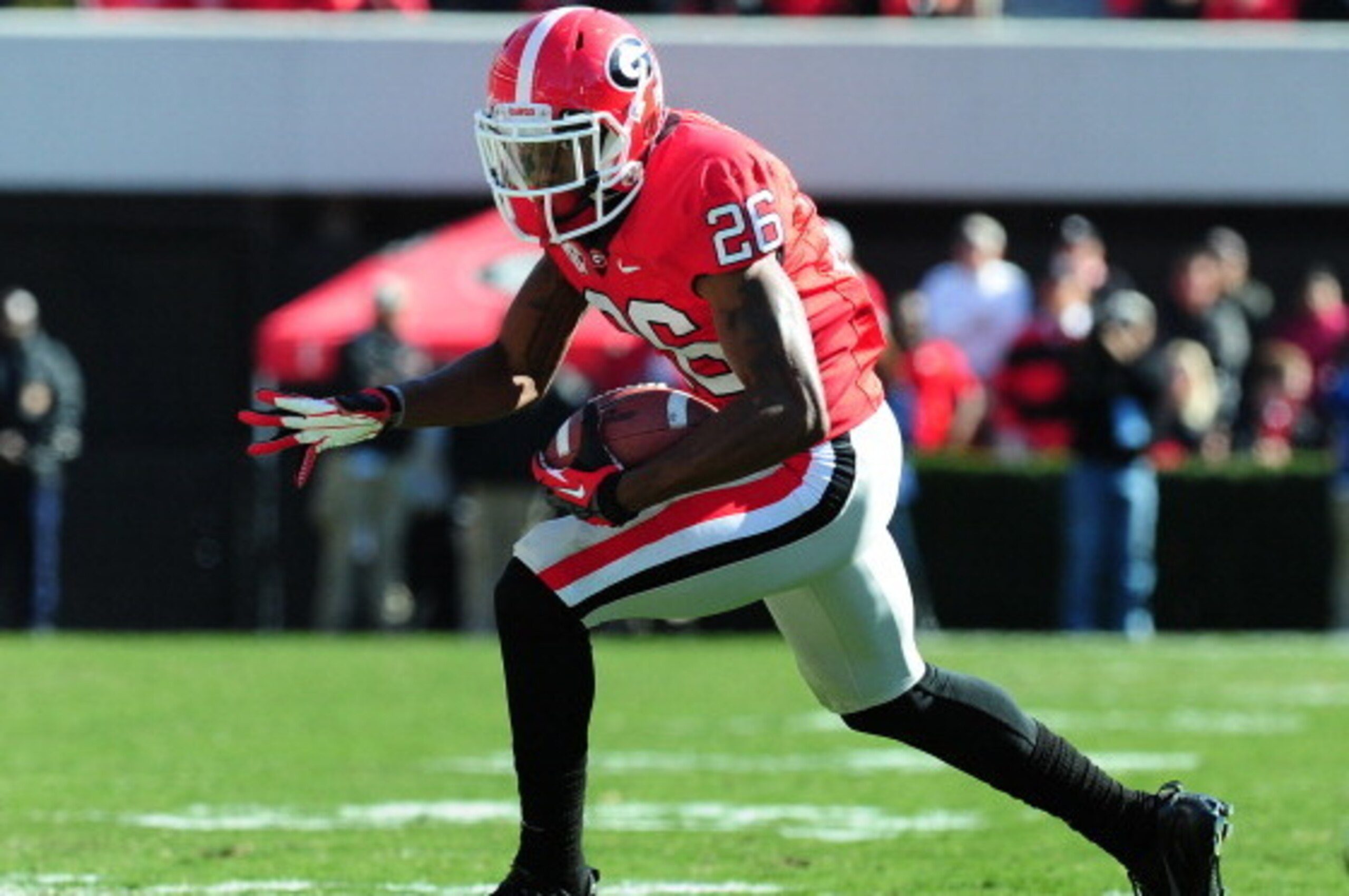 ATHENS, GA - NOVEMBER 24: Malcolm Mitchell #26 of the Georgia Bulldogs runs with a catch against the Georgia Tech Yellow Jackets at Sanford Stadium on November 24, 2012 in Athens, Georgia. (Photo by Scott Cunningham/Getty Images)