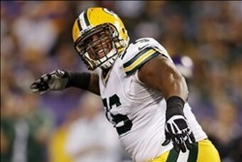 Oct 27, 2013; Minneapolis, MN, USA; Green Bay Packers defensive end Mike Daniels (76) celebrates his sack of the Minnesota Vikings quarterback in the second quarter at Mall of America Field at H.H.H. Metrodome. Mandatory Credit: Bruce Kluckhohn-USA TODAY 
