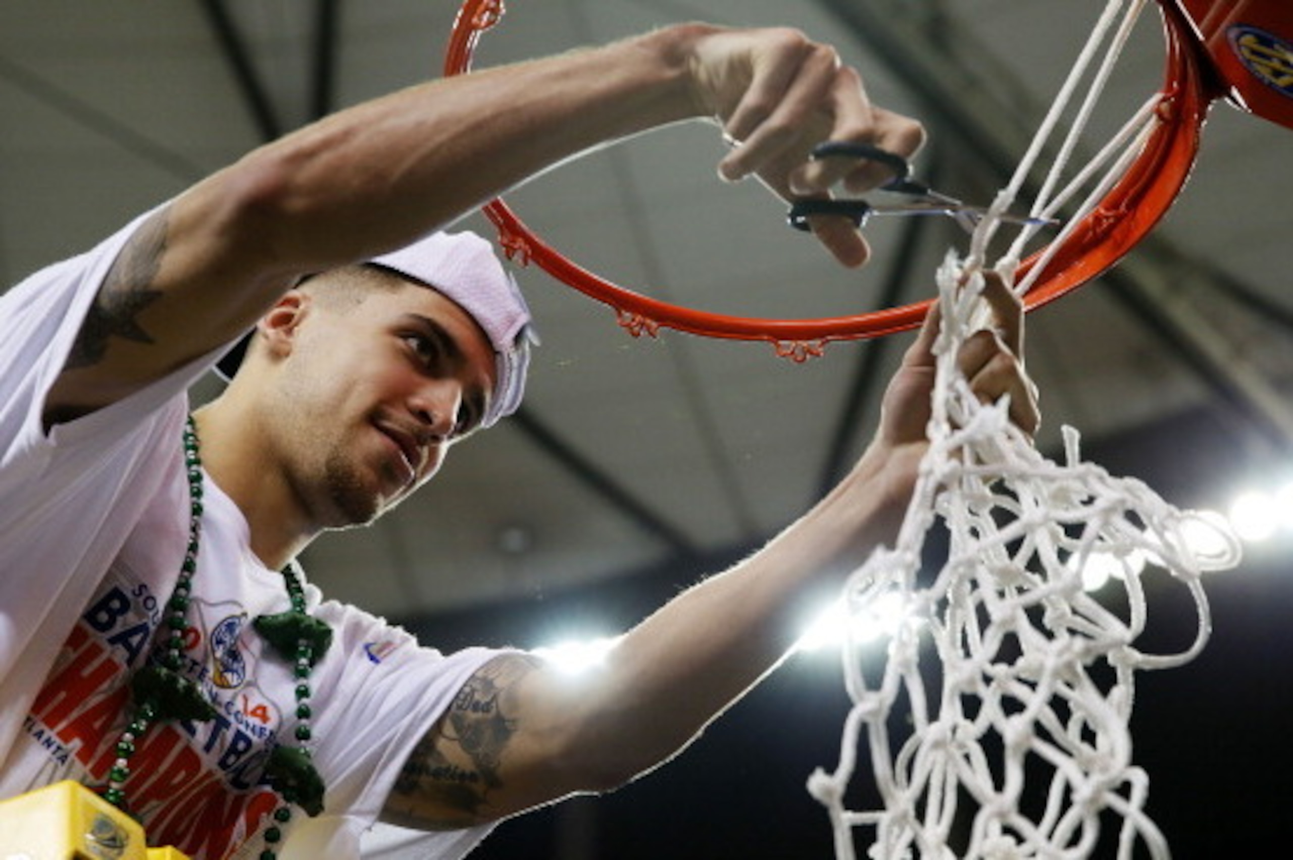 ATLANTA, GA - MARCH 16: Scottie Wilbekin #5 of the Florida Gators celebrates by cutting down the net after their 61 to 60 win over the Kentucky Wildcats in the Championship game of the 2014 Men's SEC Basketball Tournament at Georgia Dome on March 16, 201 ATLANTA, GA - MARCH 16: Scottie Wilbekin #5 of the Florida Gators celebrates by cutting down the net after their 61 to 60 win over the Kentucky Wildcats in the Championship game of the 2014 Men's SEC Basketball Tournament at Georgia Dome on March 16, 201