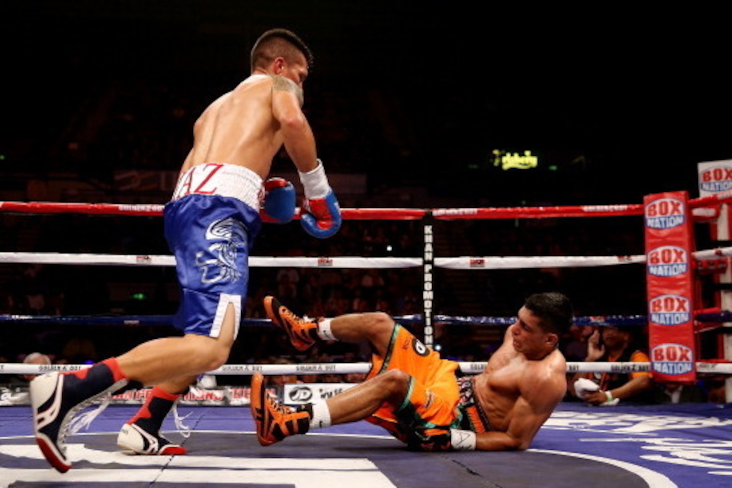 SHEFFIELD, ENGLAND - APRIL 27: Amir Khan is knocked down by Julio Diaz at Motorpoint Arena on April 27, 2013 in Sheffield, England. (Photo by Scott Heavey/Getty Images) SHEFFIELD, ENGLAND - APRIL 27: Amir Khan is knocked down by Julio Diaz at Motorpoint Arena on April 27, 2013 in Sheffield, England. (Photo by Scott Heavey/Getty Images)