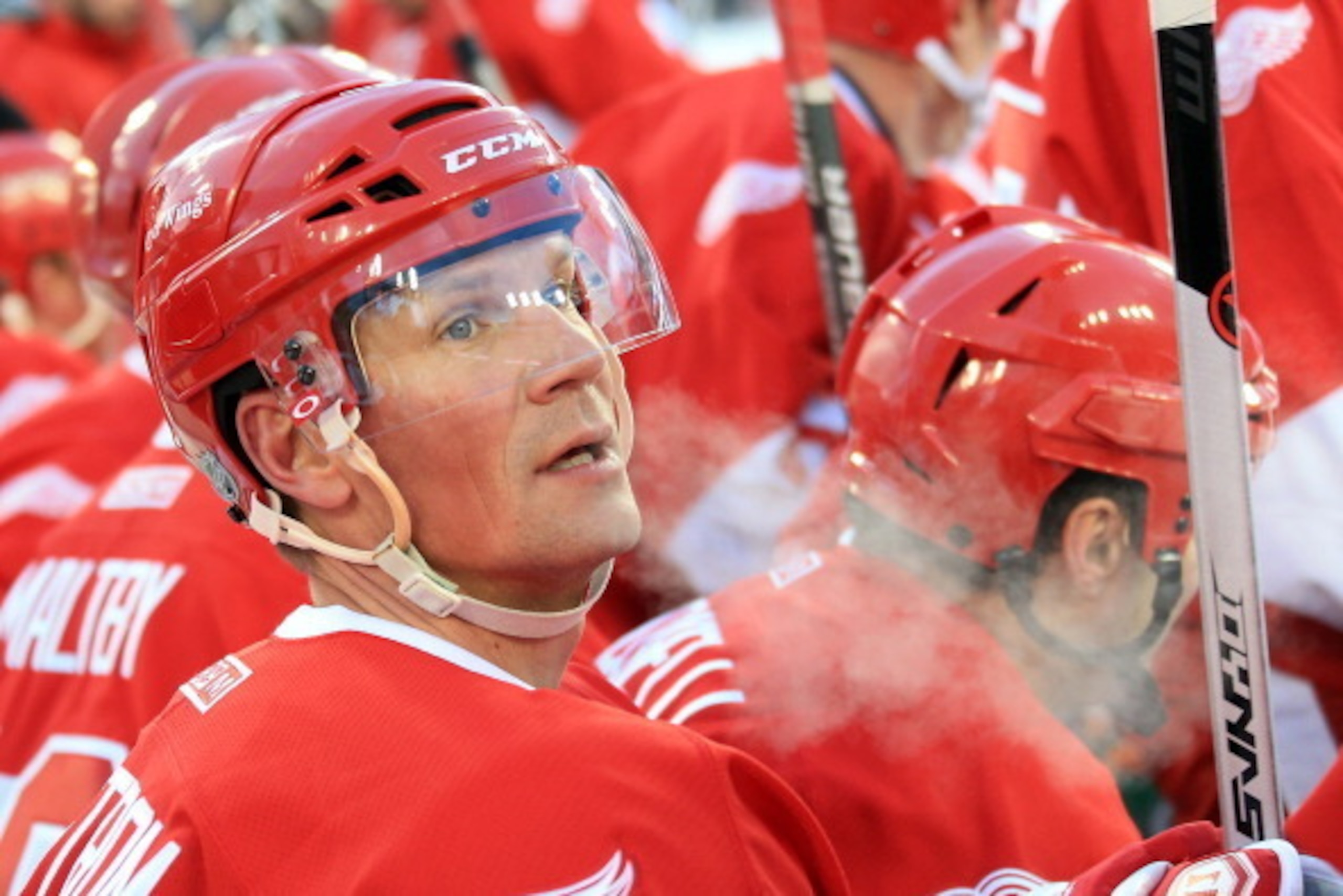 DETROIT, MI - DECEMBER 31: Nicklas Lidstrom #5 of the Detroit Red Wings watches the action from the bench against the Toronto Maple Leafs Alumni during  2014 Bridgestone NHL Winter Classic Ð Alumni Game Two played outdoors during the Hockeytown Winter Fes