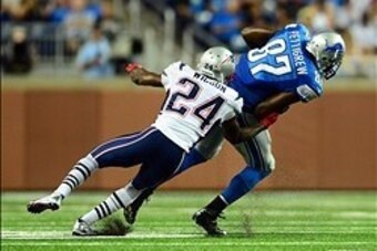 Aug 22, 2013; Detroit, MI, USA; Detroit Lions tight end Brandon Pettigrew (87) gets away from New England Patriots strong safety Adrian Wilson (24) in the second quarter of a preseason game at Ford Field. Mandatory Credit: Andrew Weber-USA TODAY Sports