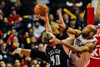 Nov 18, 2013; Chicago, IL, USA; Chicago Bulls power forward Taj Gibson (22) blocks Charlotte Bobcats center Cody Zeller (40) during the second half of their game at the United Center. The Bulls won 86-81. Mandatory Credit: Matt Marton-USA TODAY Sports