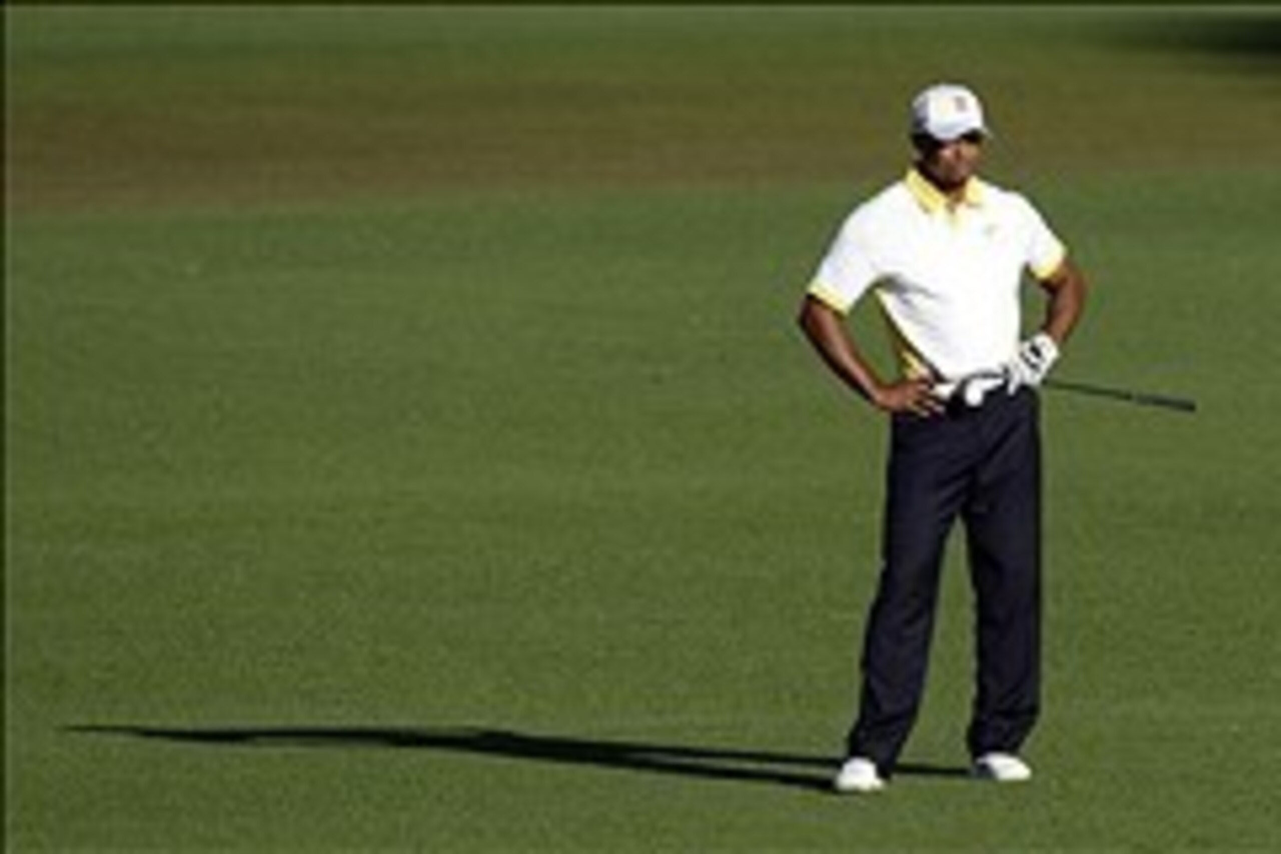 Apr 12, 2013; Augusta, GA, USA; Tiger Woods reacts after his shot from the 15th fairway bounced off the cup and into the water during the second round of the 2013 The Masters golf tournament at Augusta National Golf Club.  Mandatory Credit: Michael Madrid