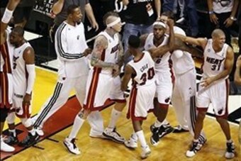 May 22, 2013; Miami, FL, USA;  Miami Heat small forward LeBron James (6) is congratulated by teammates power forward Chris Andersen (11), small forward Shane Battier (31) and point guard Norris Cole (30) on his game winning shot to beat the Indiana Pacers