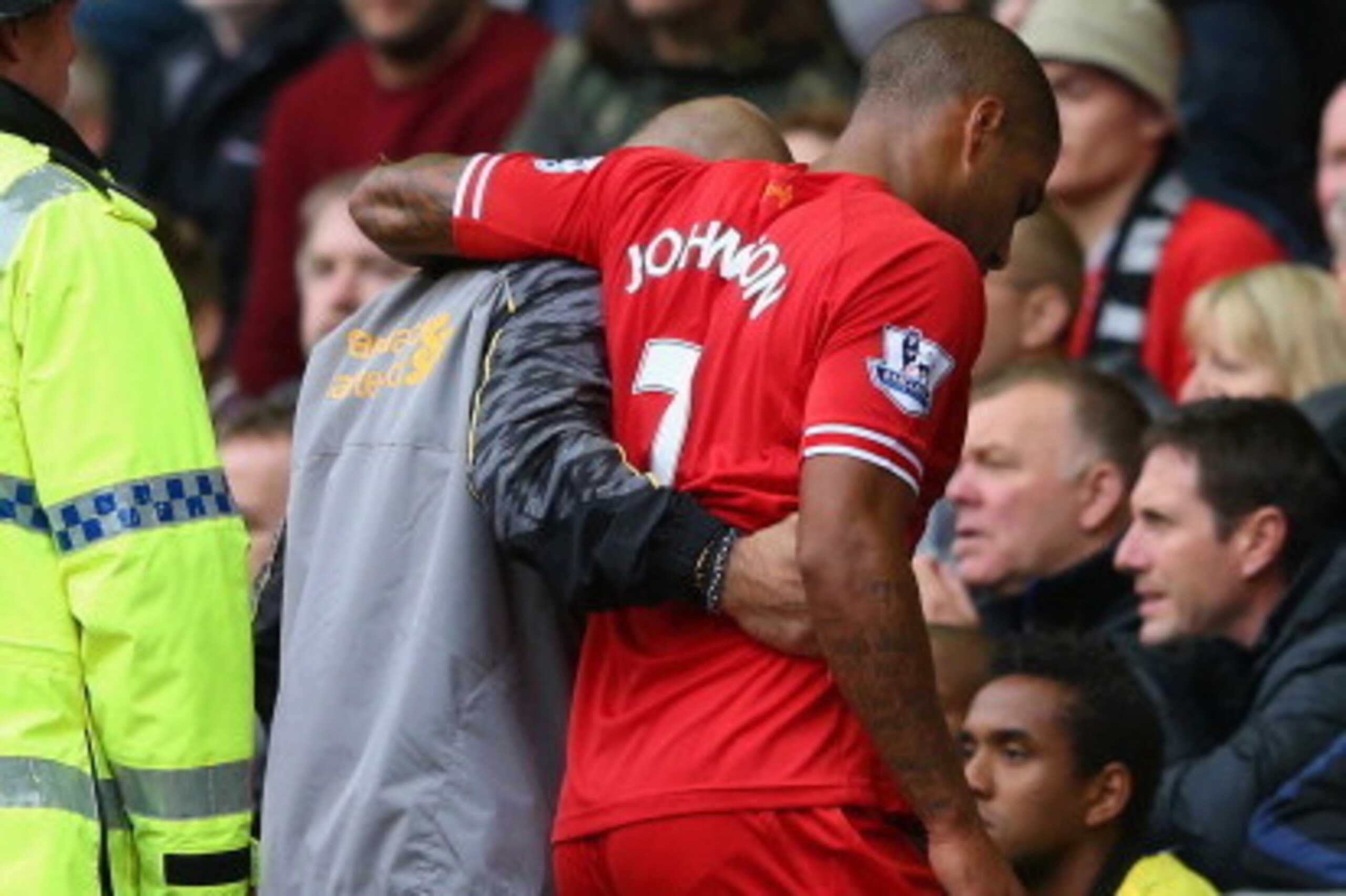 LIVERPOOL, ENGLAND - SEPTEMBER 01:  Glen Johnson of Liverpool is helped down the tunnel during the Barclays Premier League match between Liverpool and Manchester United at Anfield on September 01, 2013 in Liverpool, England.  (Photo by Alex Livesey/Getty 