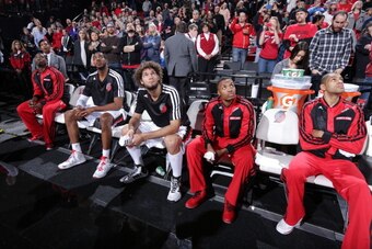 PORTLAND, OR - DECEMBER 6:  Wesley Matthews #2, LaMarcus Aldridge #12, Robin Lopez #42, Damian Lillard #0 and Nicolas Batum #88 of the Portland Trail Blazers sit on the bench before the game against the Utah Jazz on December 6, 2013 at the Moda Center Are