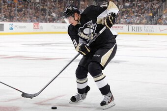 PITTSBURGH, PA - OCTOBER 3:  Beau Bennett #19 of the Pittsburgh Penguins moves the puck against the New Jersey Devils on October 3, 2013 at Consol Energy Center in Pittsburgh, Pennsylvania.  (Photo by Gregory Shamus/NHLI via Getty Images)