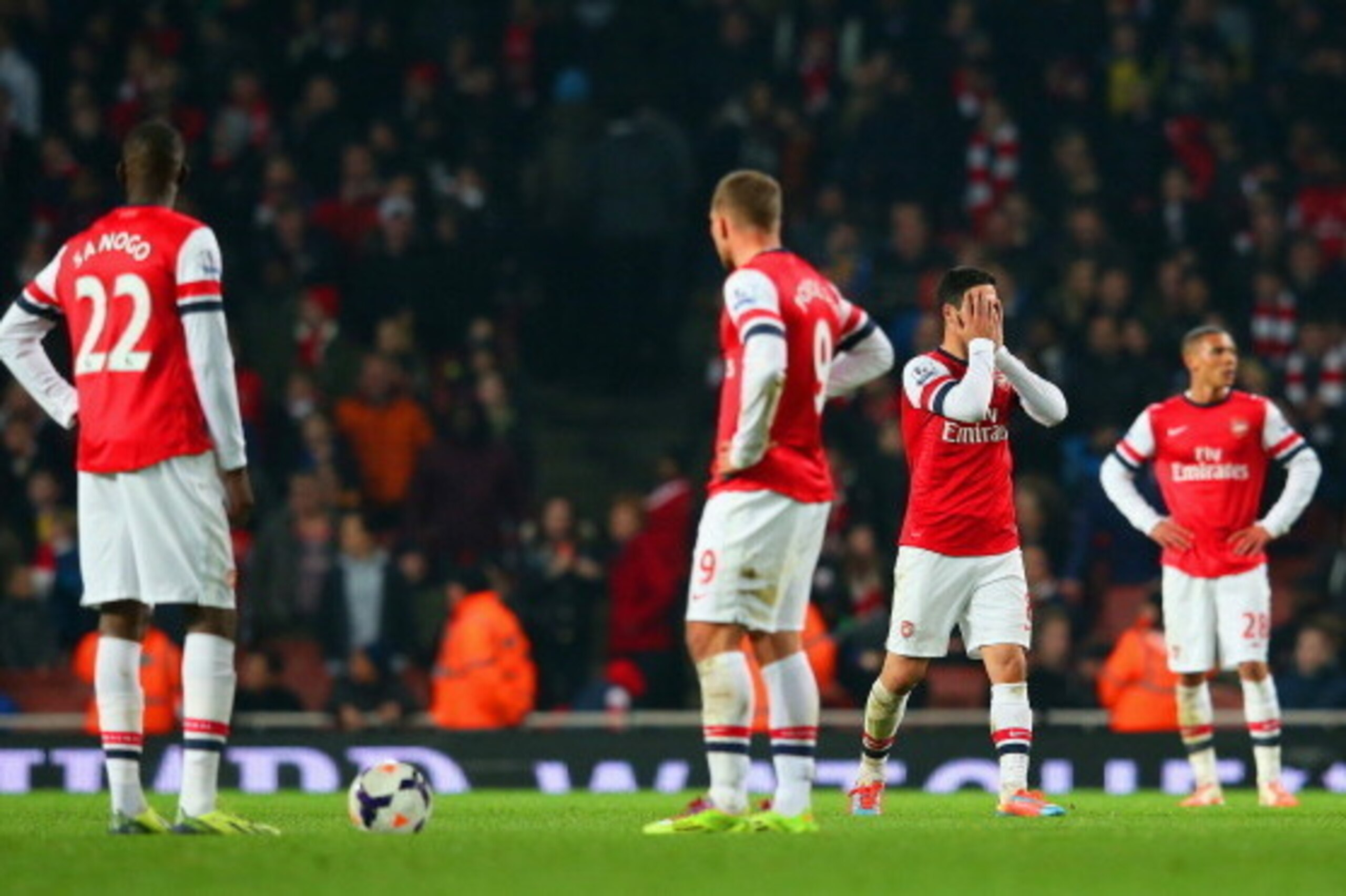 LONDON, ENGLAND - MARCH 25:  A dejected Mikel Arteta of Arsenal holds his head in his hands after Mathieu Flamini of Arsenal (not pictured) scored an own goal in the final minutes during the Barclays Premier League match between Arsenal and Swansea City a