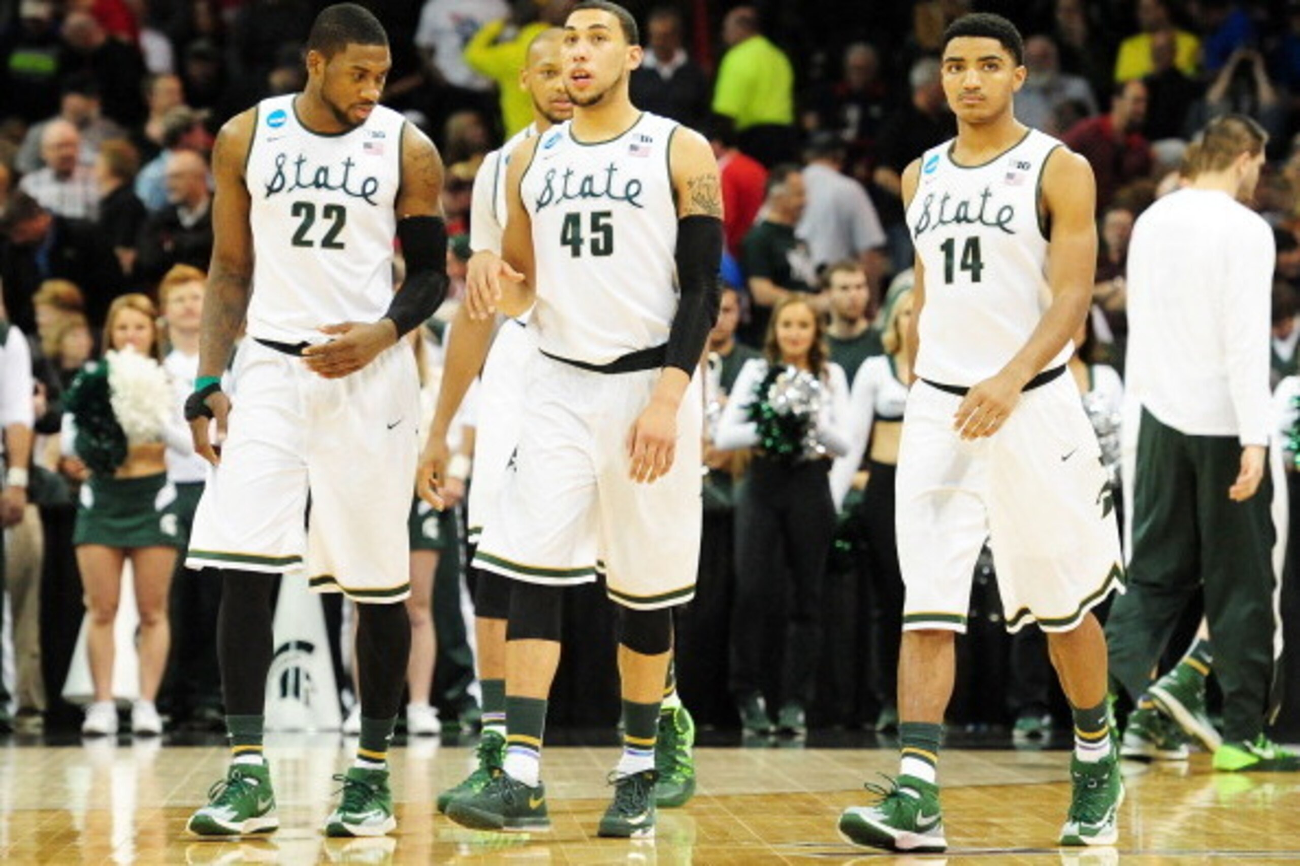 SPOKANE, WA - MARCH 22:  Branden Dawson #22 Adreian Payne #5 Denzel Valentine #45 and Gary Harris #14 of the Michigan State Spartans look on in the second half against the Harvard Crimson during the Third Round of the 2014 NCAA Basketball Tournament at Sp