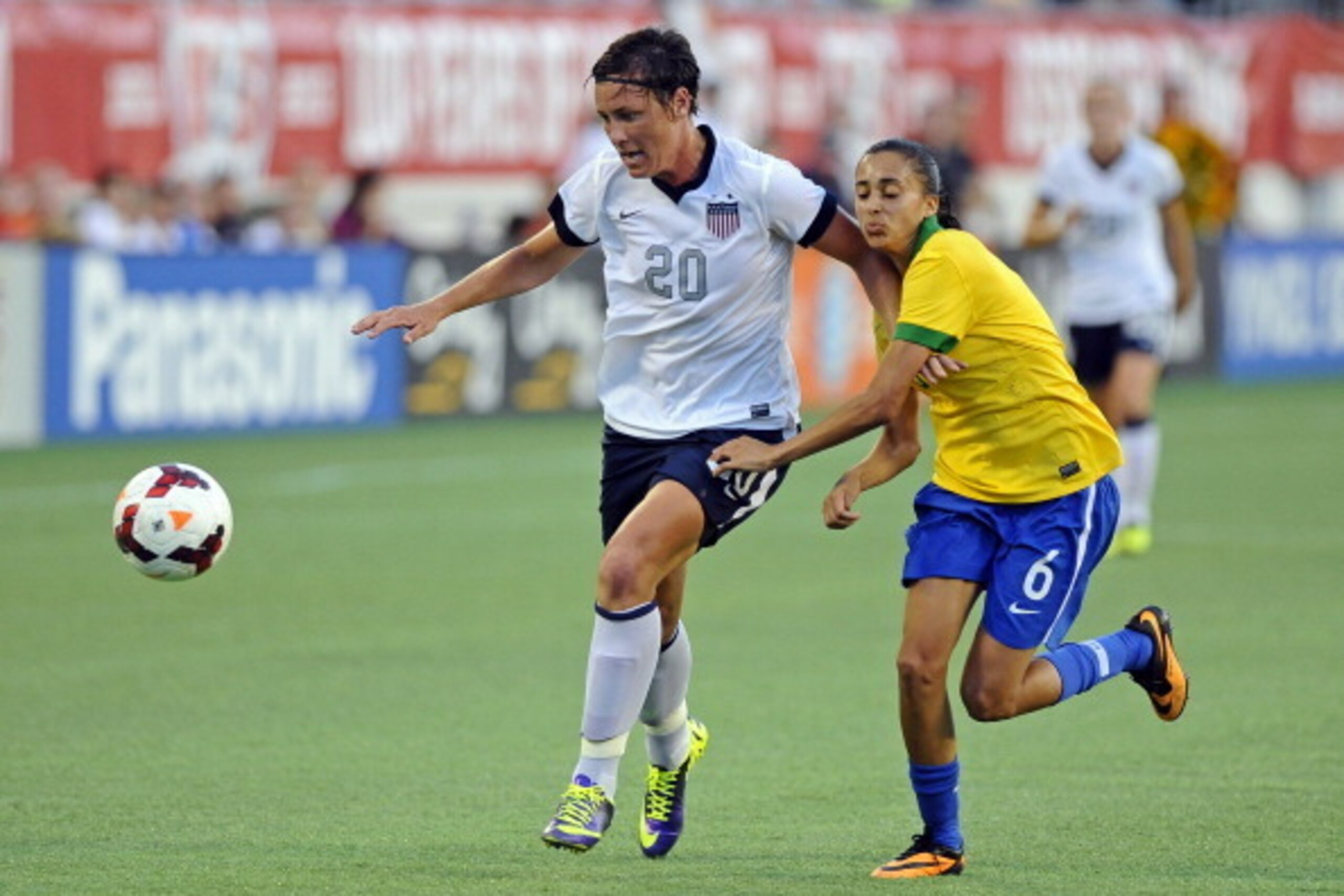 ORLANDO, FL - NOVEMBER 10:  Forward Abby Wambach #20 of the U.S. Women's National Team controls the ball ahead of midfielder Andressa #6 of Brazil on November 10, 2013 at Florida Citrus Bowl Stadium in Orlando, Florida.  (Photo by Brian Blanco/Getty Image