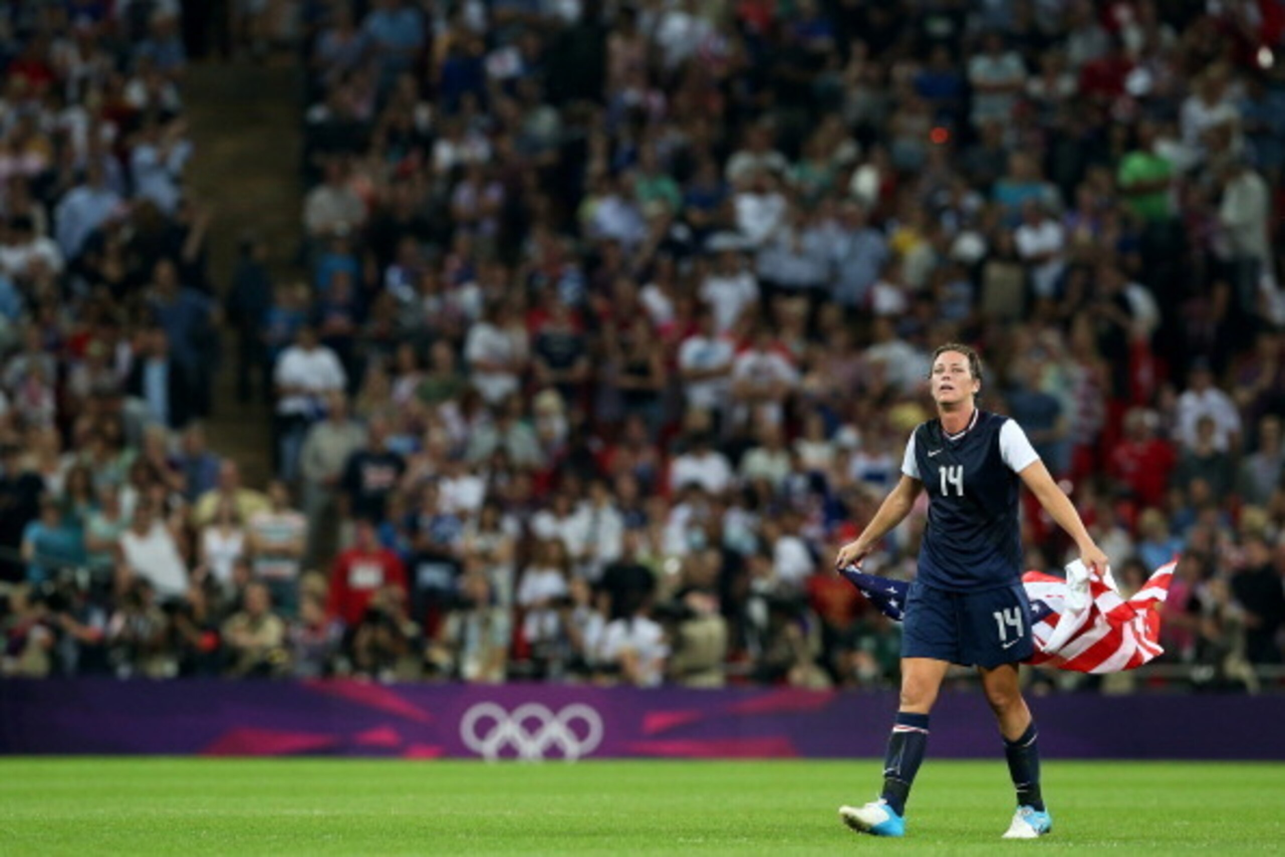 LONDON, ENGLAND - AUGUST 09:  Abby Wambach #14  of the United States celebrates after defeating Japan by a score of 2-1 to win the Women's Football gold medal match on Day 13 of the London 2012 Olympic Games at Wembley Stadium on August 9, 2012 in London,