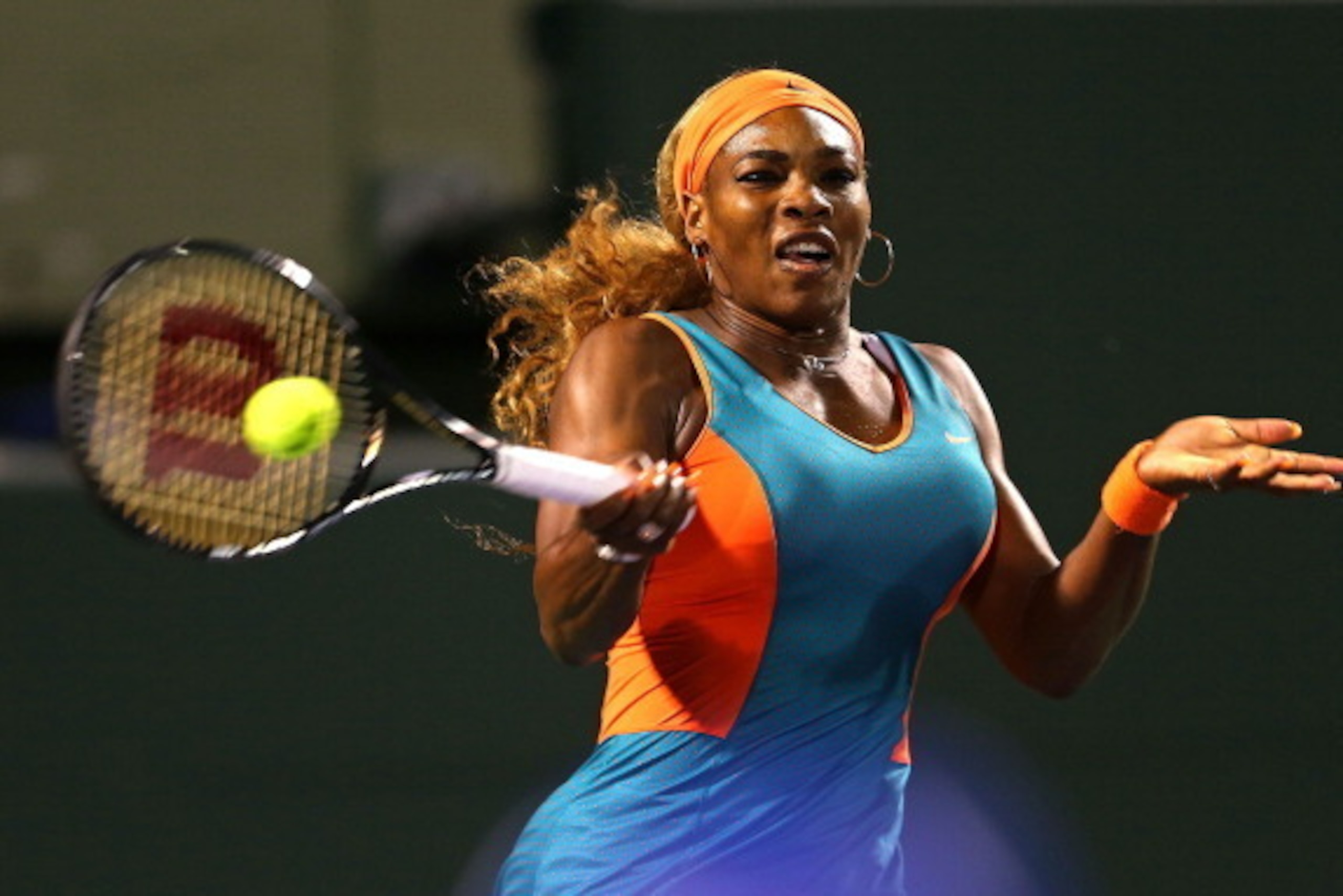 KEY BISCAYNE, FL - MARCH 25:  Serena Willaims returns a shot to Angelique Kerber of Germany during their match on Day 9 of the Sony Open at Carndon Park Tennis Center on March 25, 2014 in Key Biscayne, Florida.  (Photo by Mike Ehrmann/Getty Images)