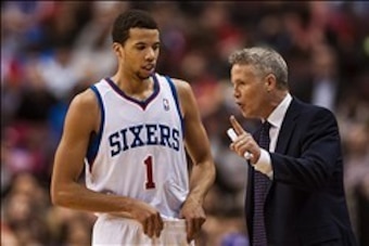 Feb 5, 2014; Philadelphia, PA, USA; Philadelphia 76ers head coach Brett Brown talks with guard Michael Carter-Williams (1) during the fourth quarter against the Boston Celtics at the Wells Fargo Center. The Celtics defeated the Sixers 114-108. Mandatory C Feb 5, 2014; Philadelphia, PA, USA; Philadelphia 76ers head coach Brett Brown talks with guard Michael Carter-Williams (1) during the fourth quarter against the Boston Celtics at the Wells Fargo Center. The Celtics defeated the Sixers 114-108. Mandatory C