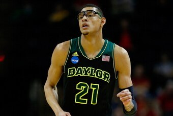 SAN ANTONIO, TX - MARCH 23: Isaiah Austin #21 of the Baylor Bears runs up the floor against the Creighton Bluejays during the third round of the 2014 NCAA Men's Basketball Tournament at the AT&T Center on March 23, 2014 in San Antonio, Texas.  (Photo by T